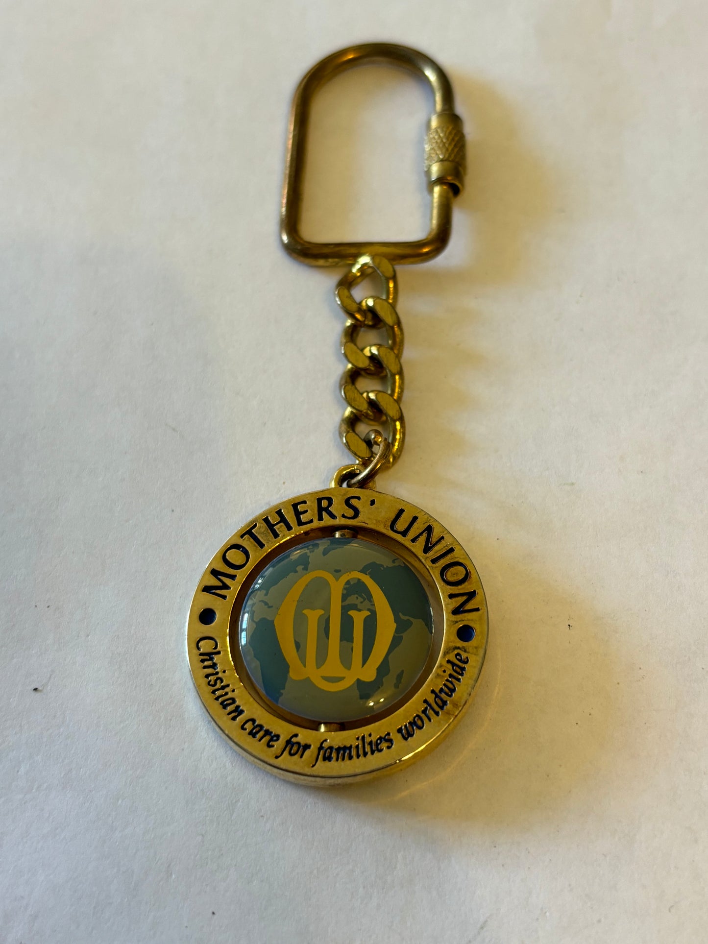 Large gold metal Mothers Union spinning keyring