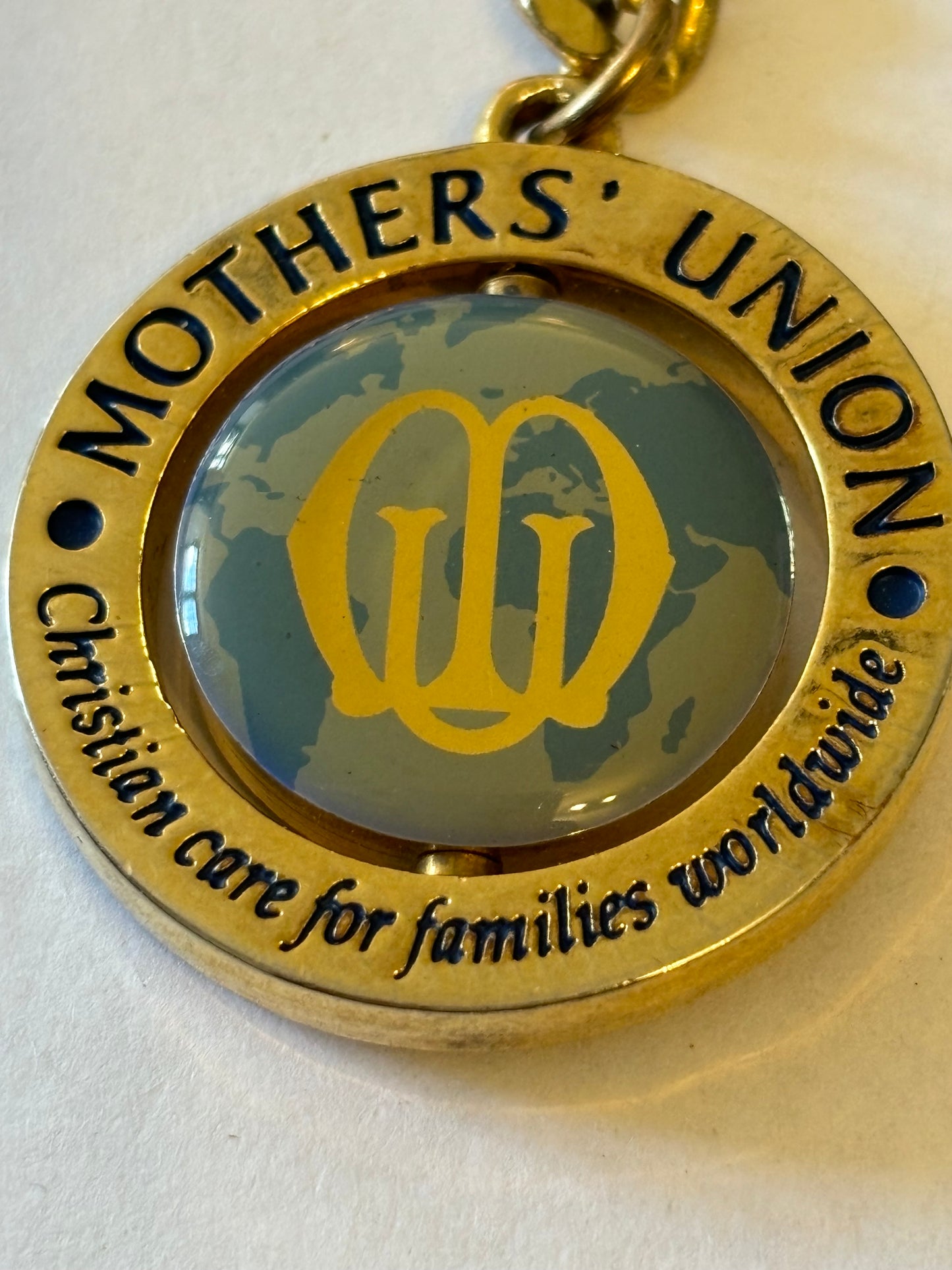 Large gold metal Mothers Union spinning keyring