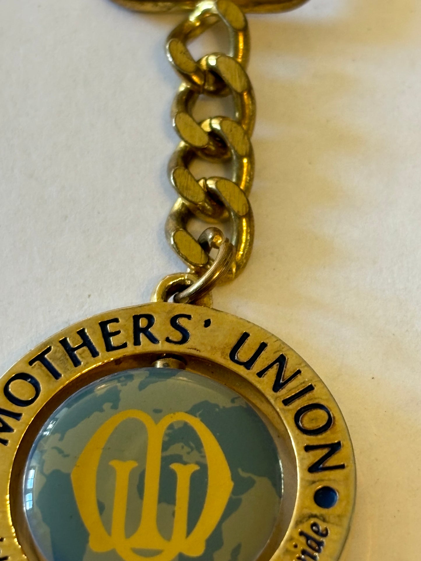 Large gold metal Mothers Union spinning keyring