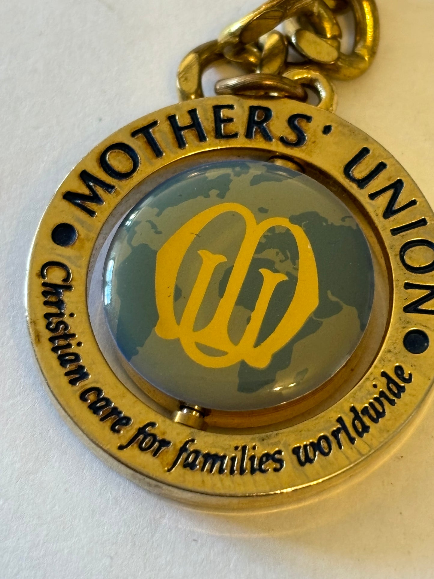 Large gold metal Mothers Union spinning keyring