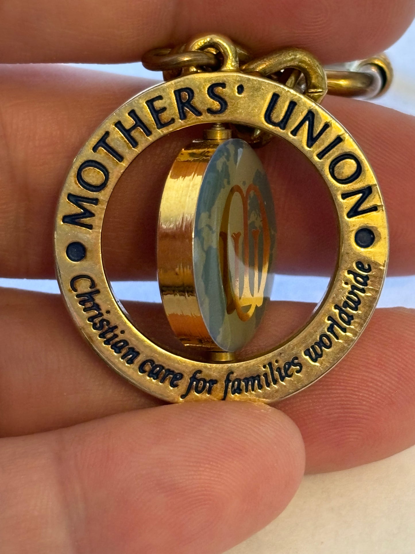 Large gold metal Mothers Union spinning keyring