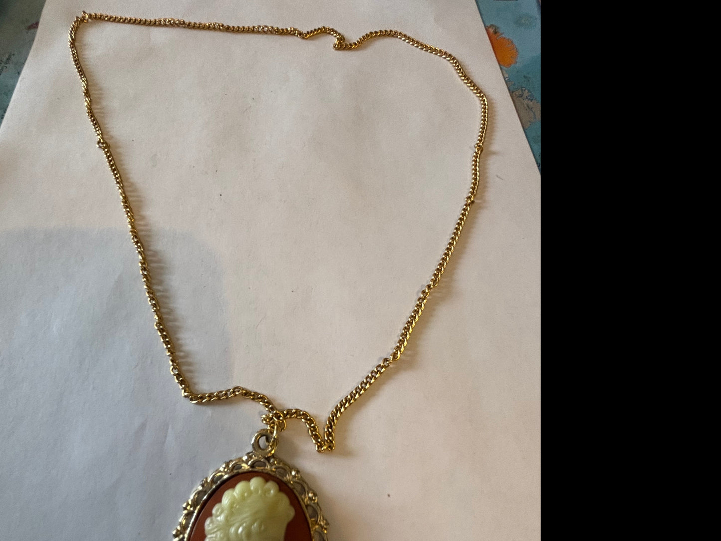 Long gold metal necklace with Cameo pendant