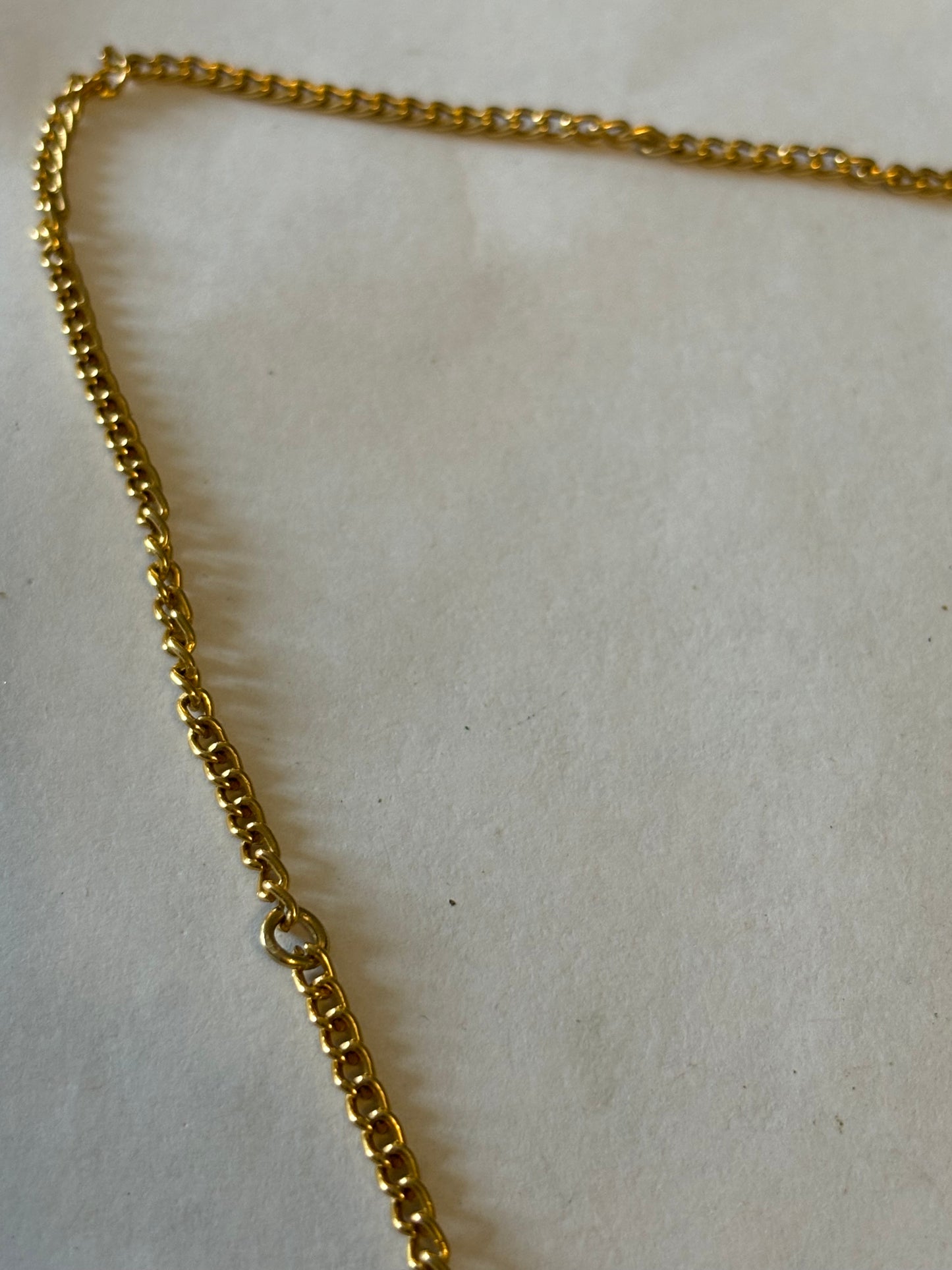 Long gold metal necklace with Cameo pendant