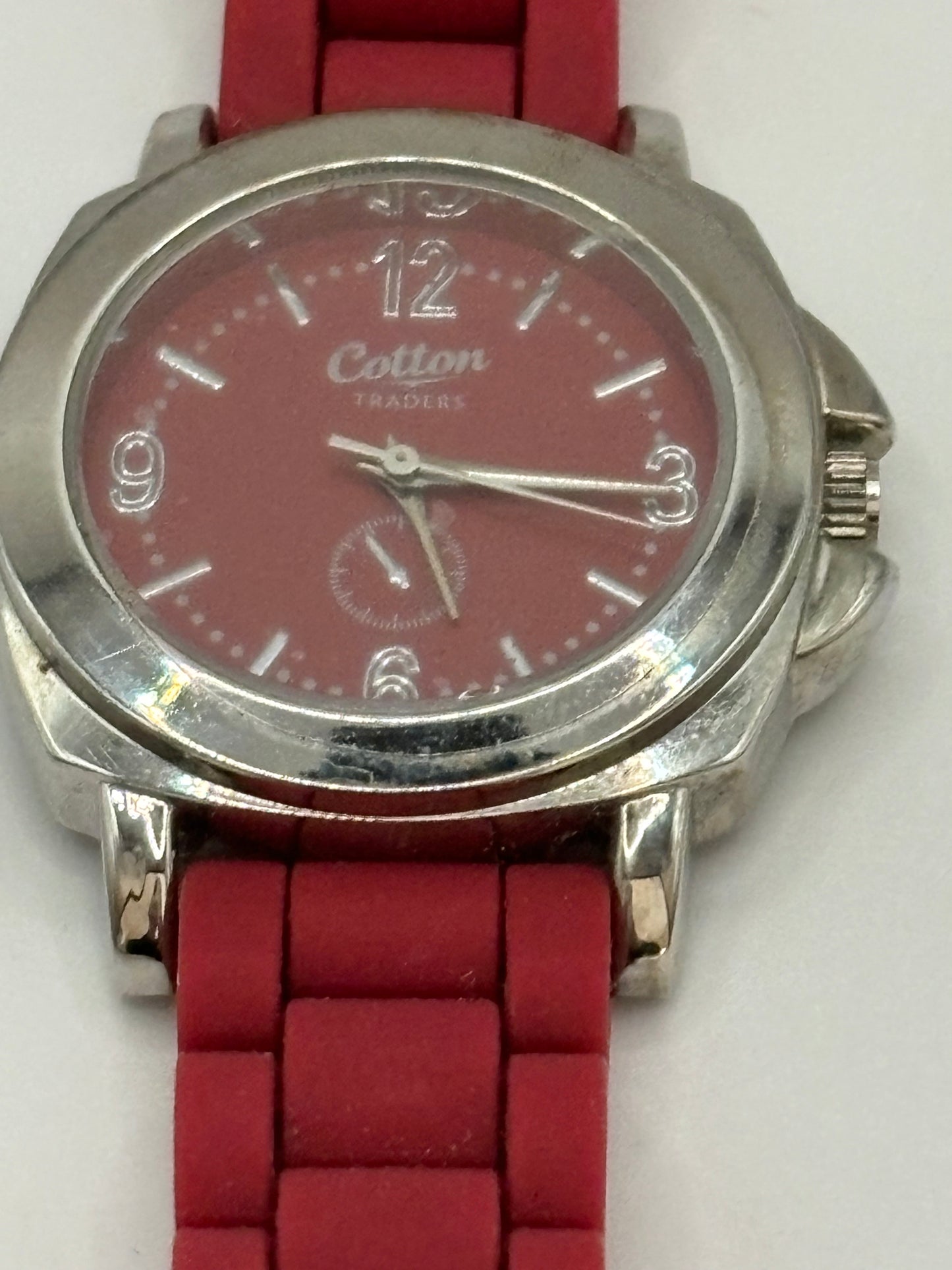 Pink rubber Cotton Traders and silver wristwatch