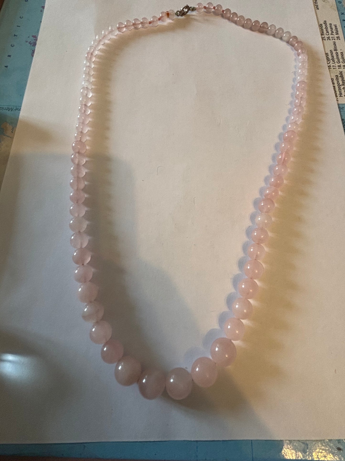 Light pink glassy bead necklace with sterling silver clasp