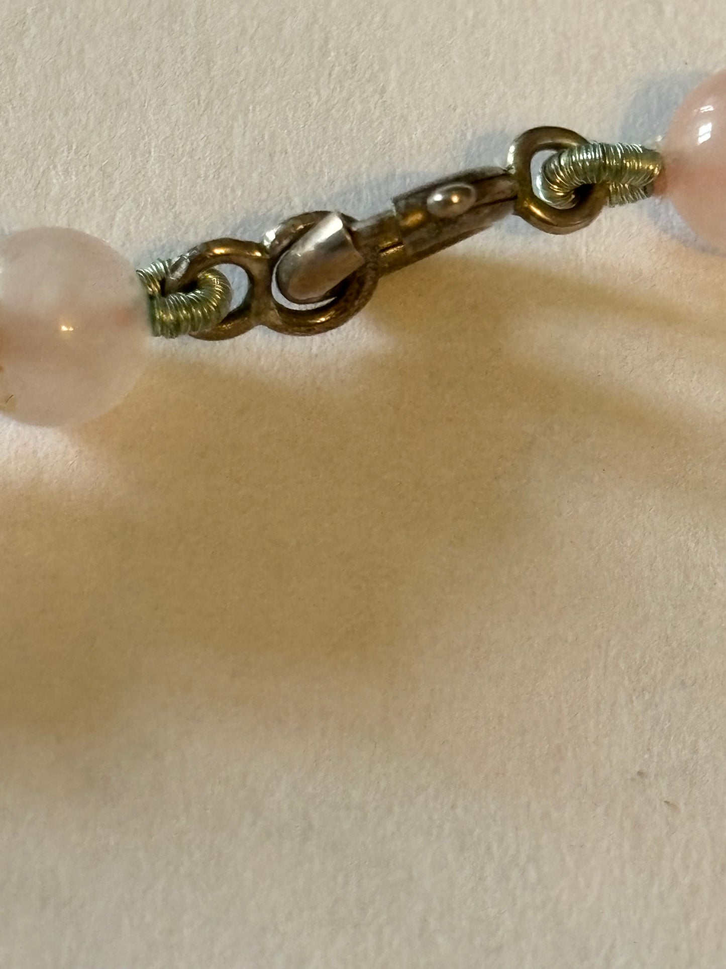 Light pink glassy bead necklace with sterling silver clasp