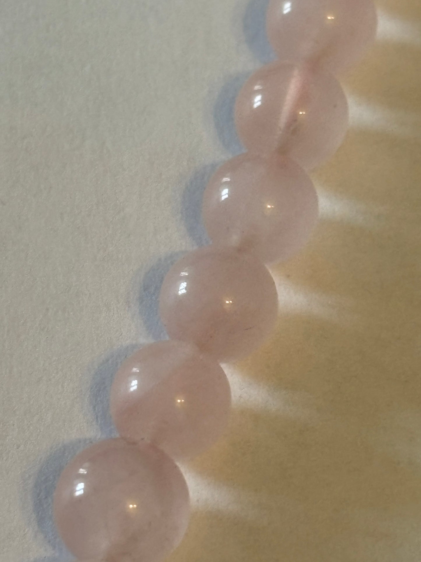 Light pink glassy bead necklace with sterling silver clasp