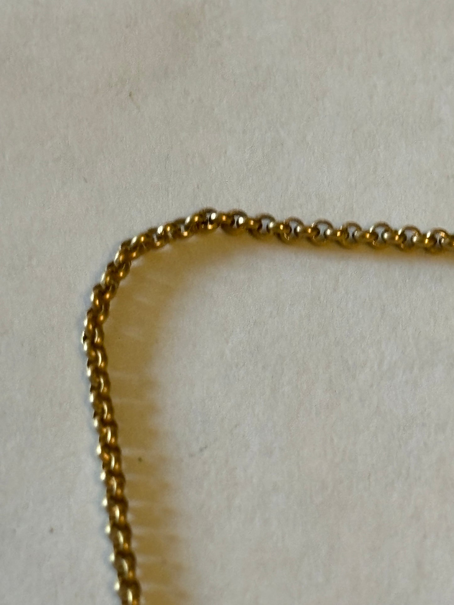 Gold Metal chain necklace with a row of 5 white stones pendant