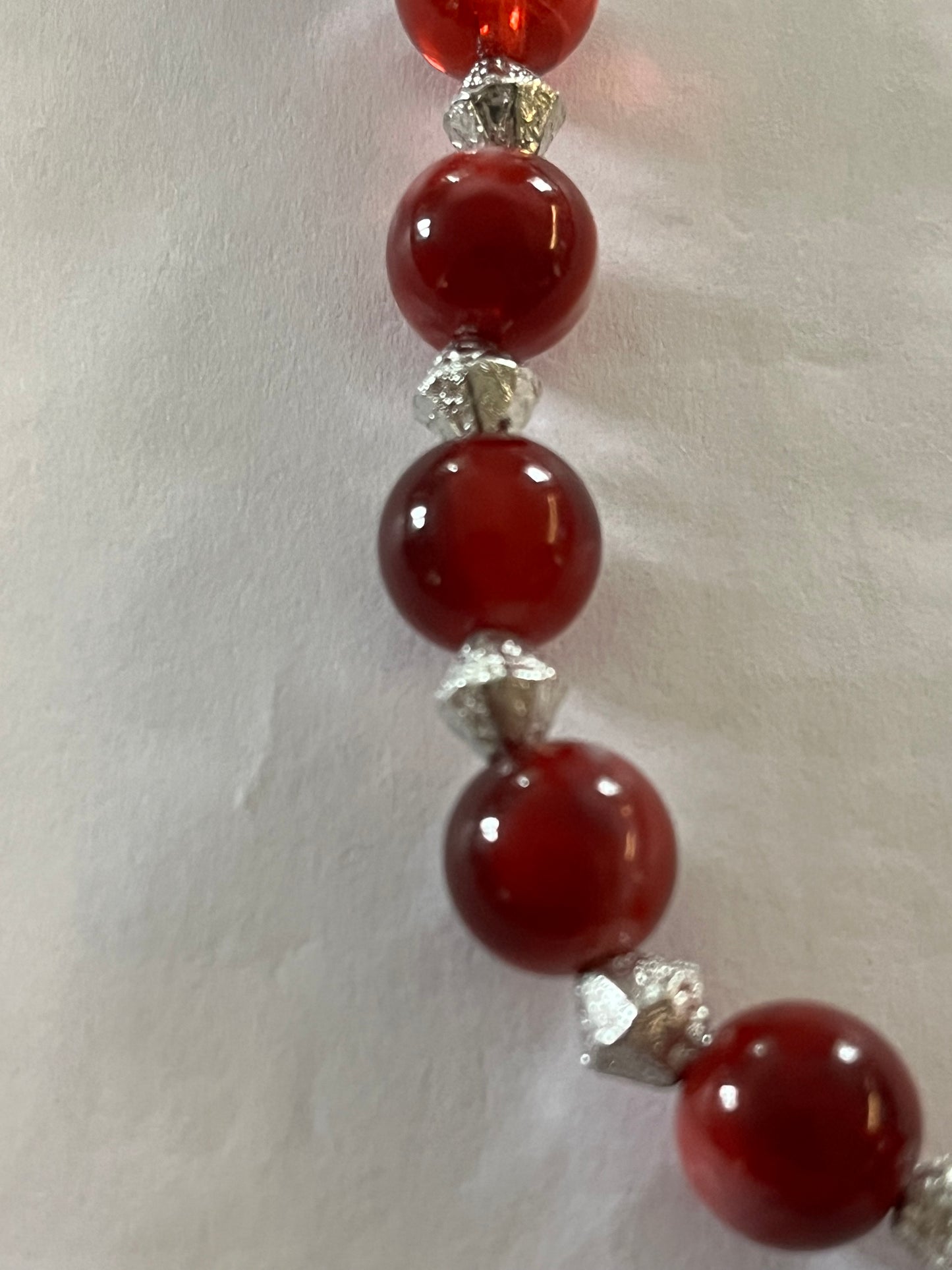 Red marbled bead necklace with silver spacers and matching bracelet