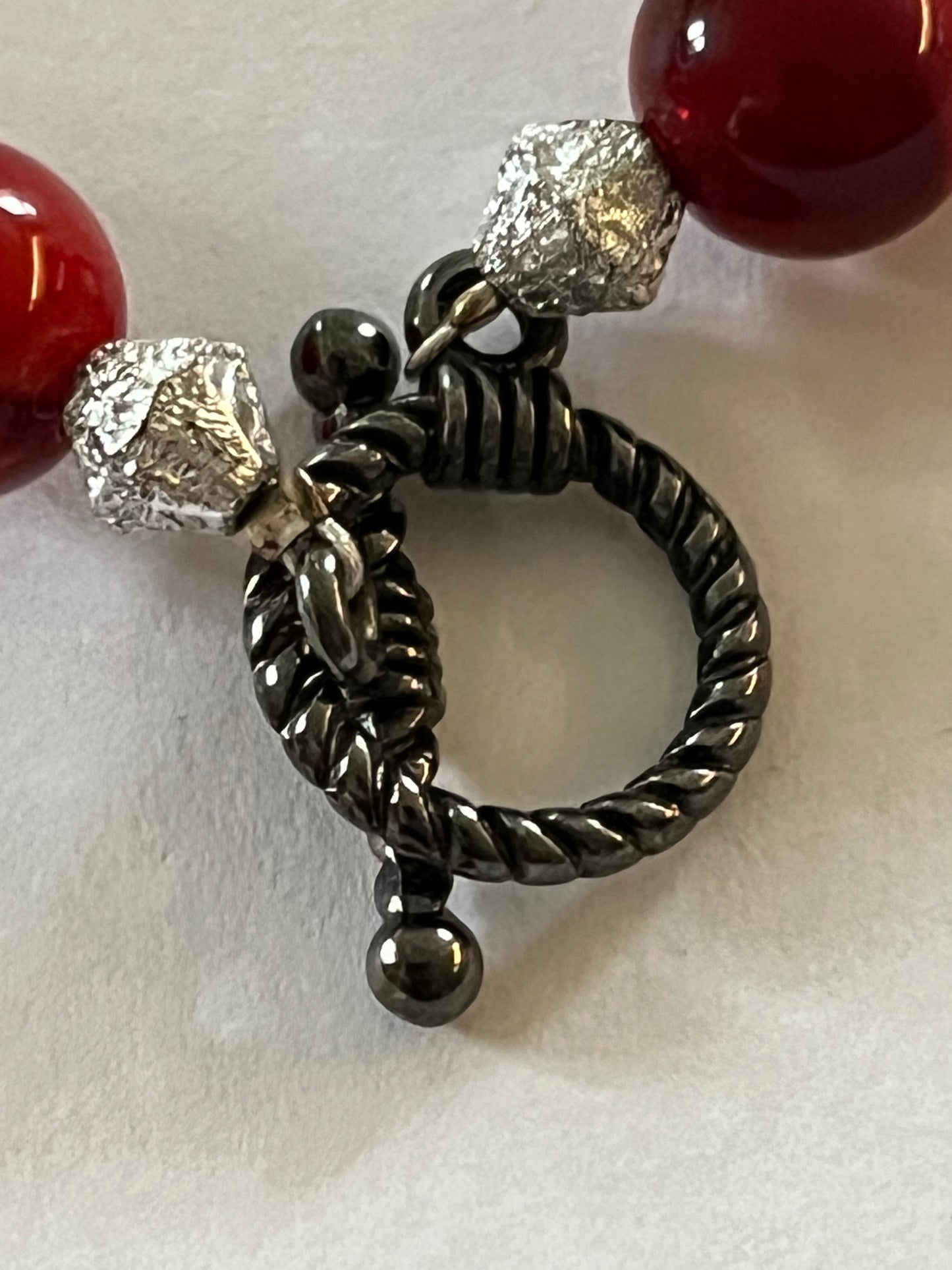 Red marbled bead necklace with silver spacers and matching bracelet