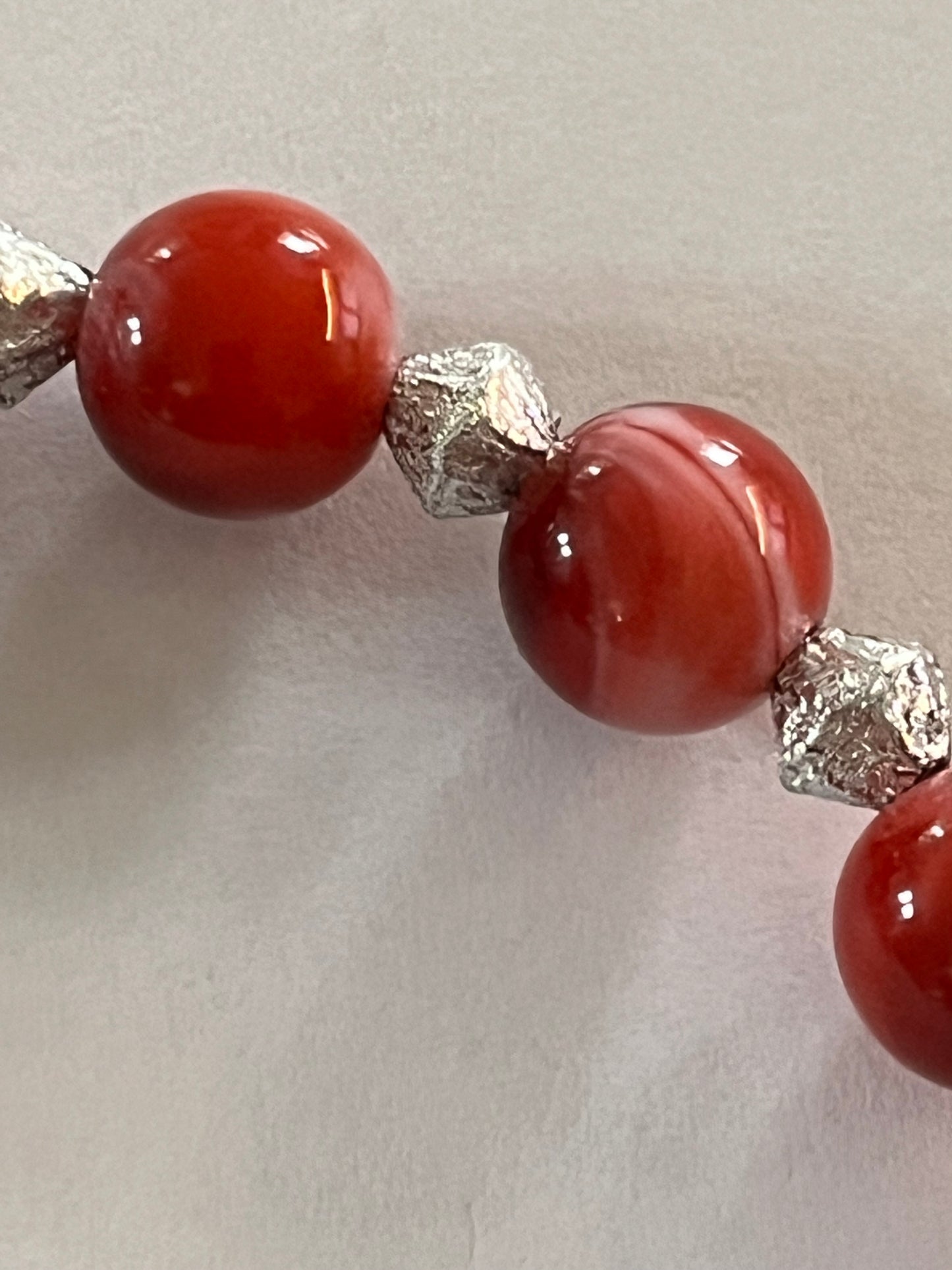 Red marbled bead necklace with silver spacers and matching bracelet