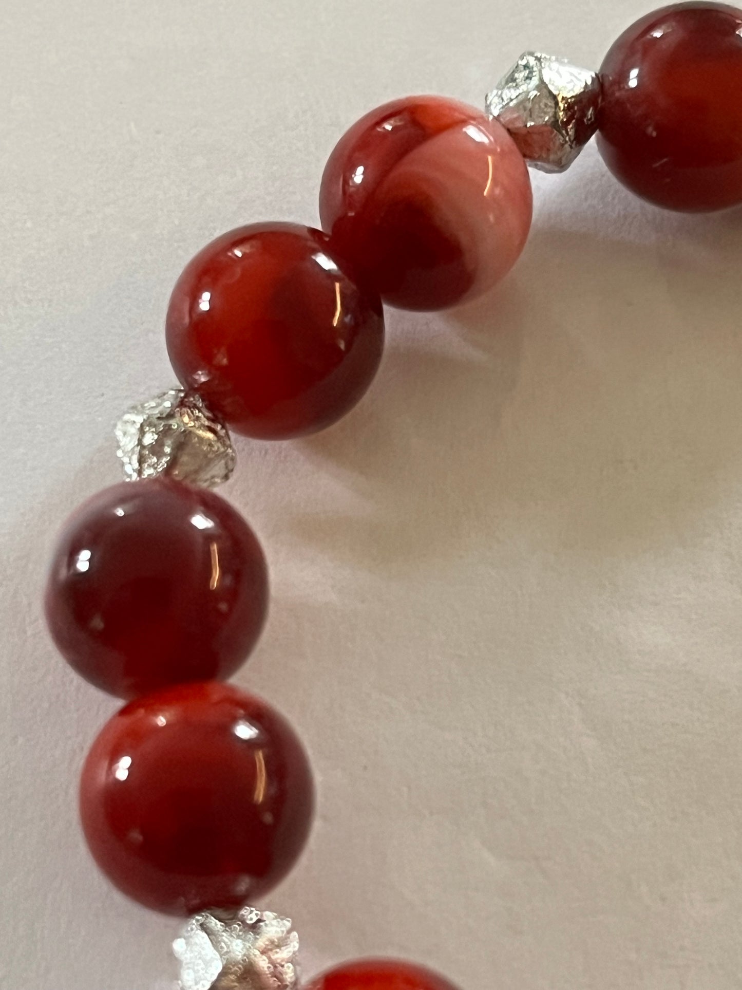 Red marbled bead necklace with silver spacers and matching bracelet