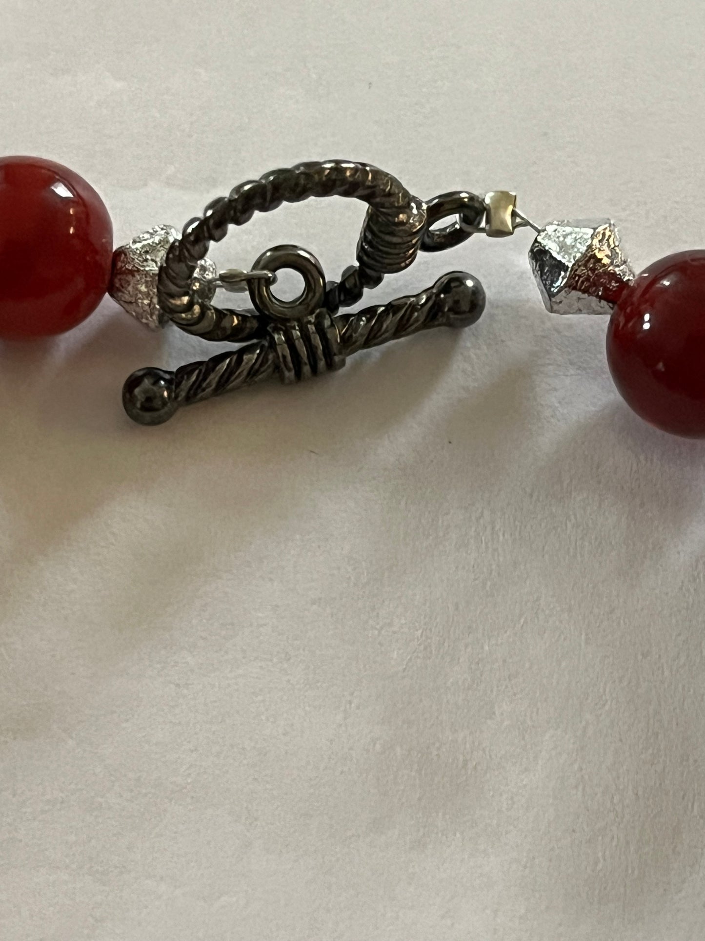 Red marbled bead necklace with silver spacers and matching bracelet