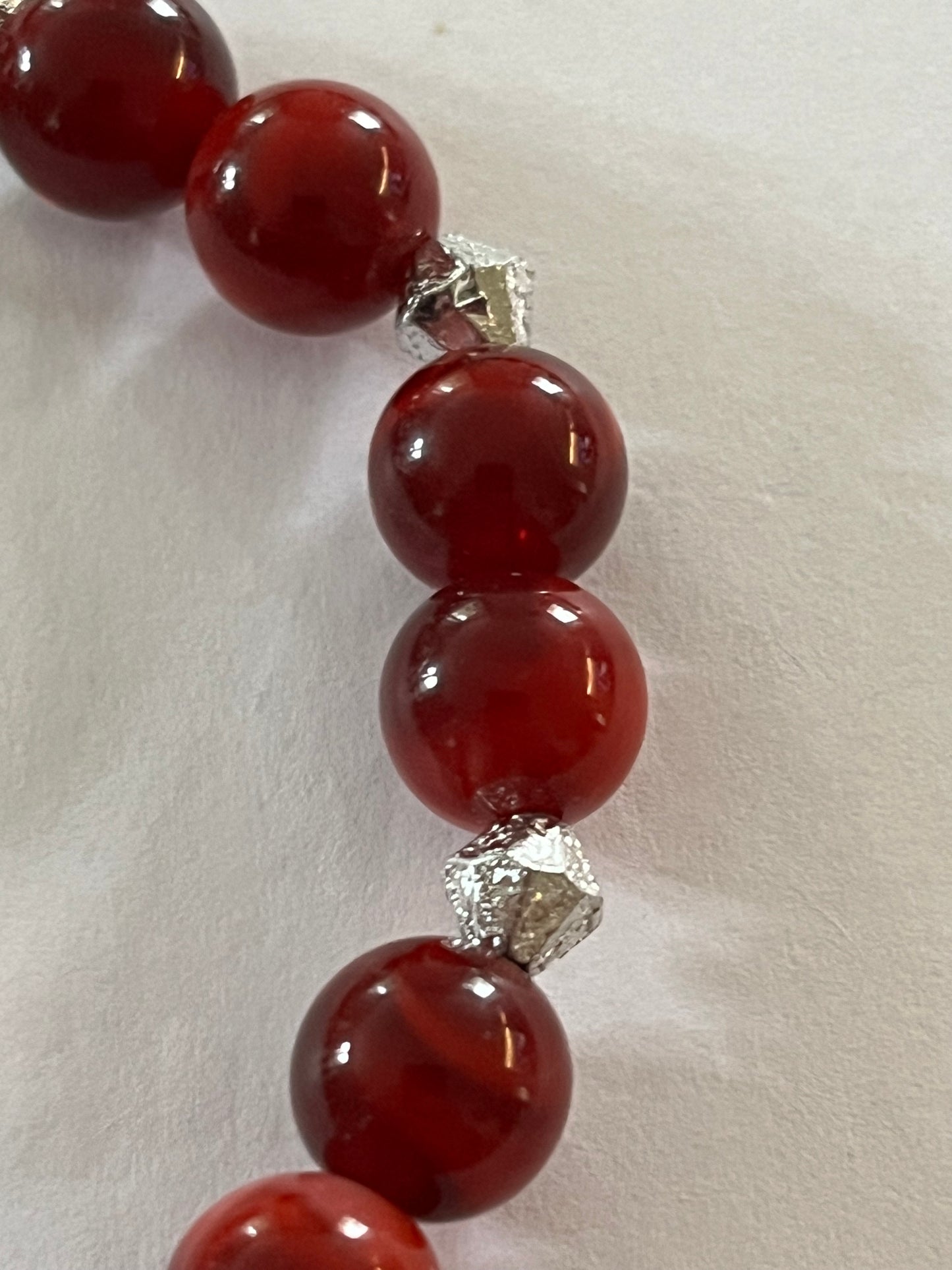 Red marbled bead necklace with silver spacers and matching bracelet