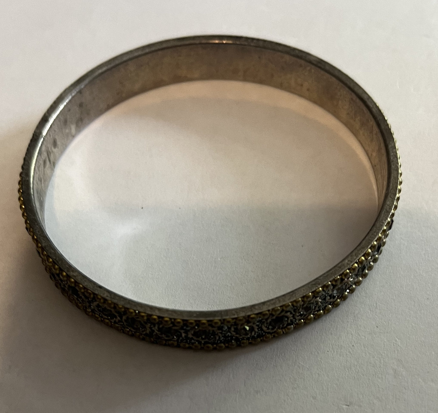 Silver patterned bangle, gold beading, silver sparkles etc.