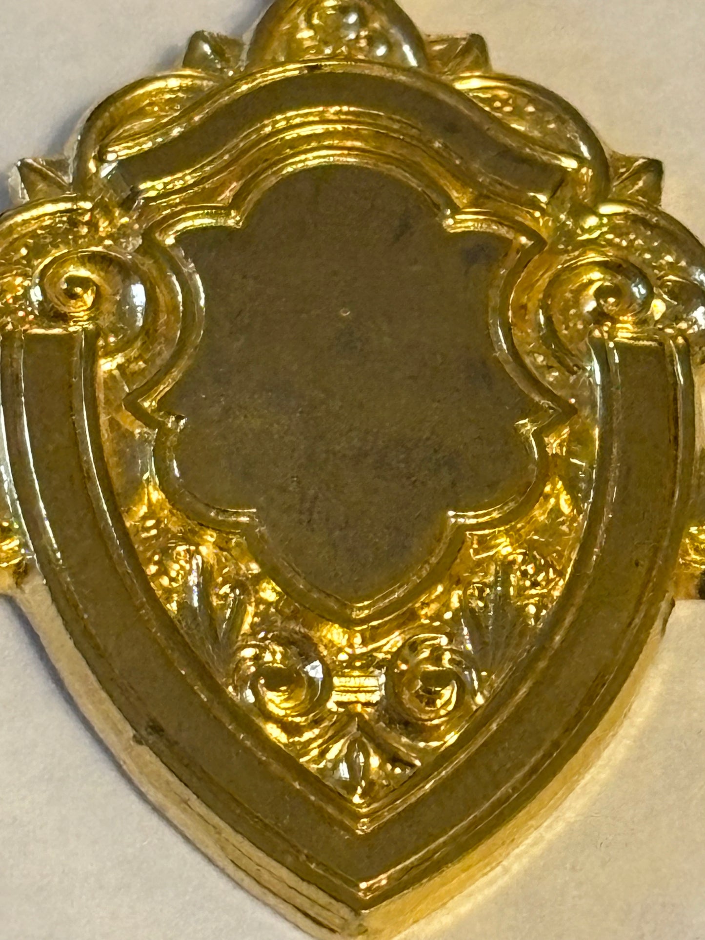 Small gold metal blank shield medal