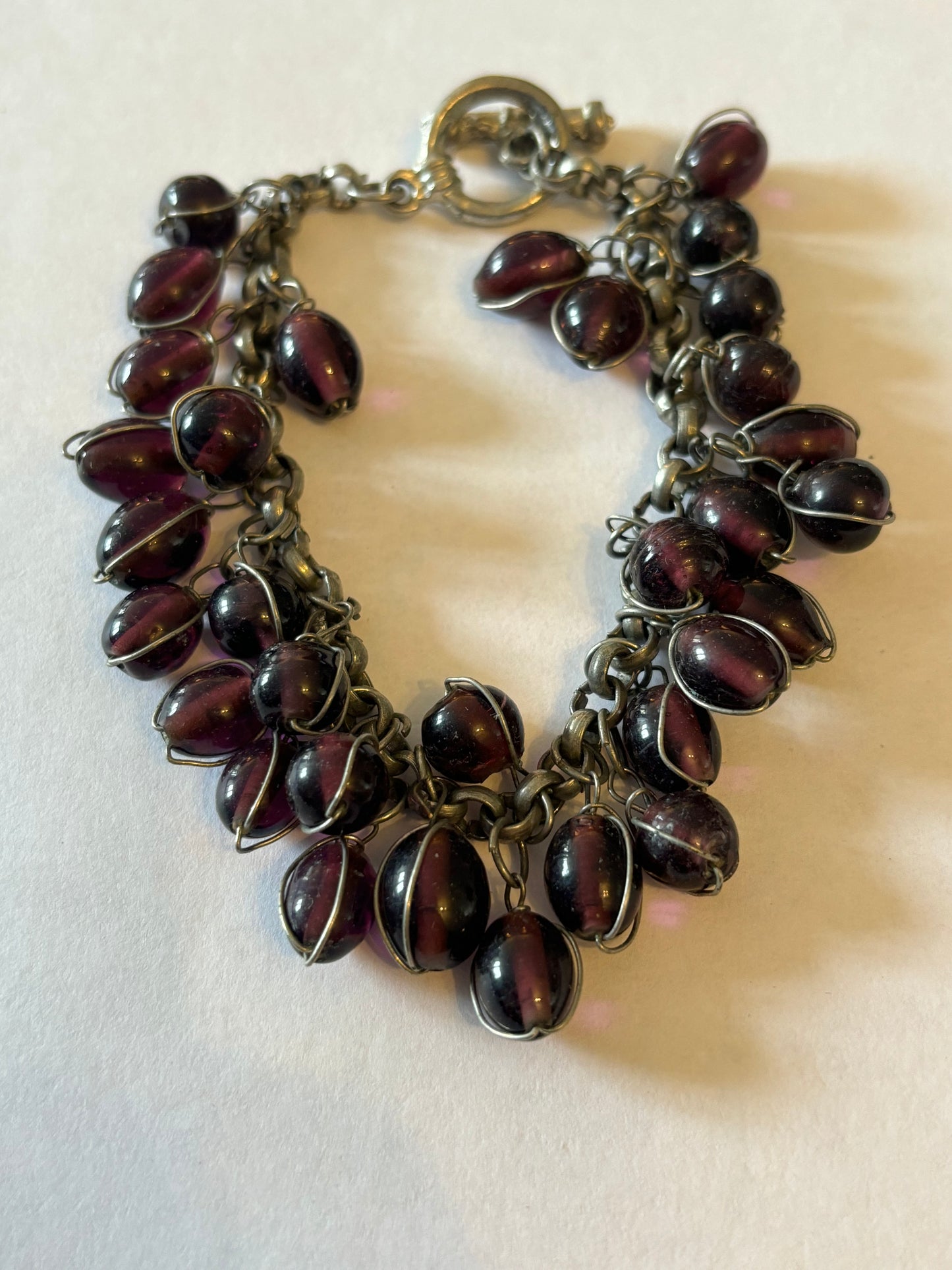 Silver metal T-Bar bracelet with dangle purple oval beads