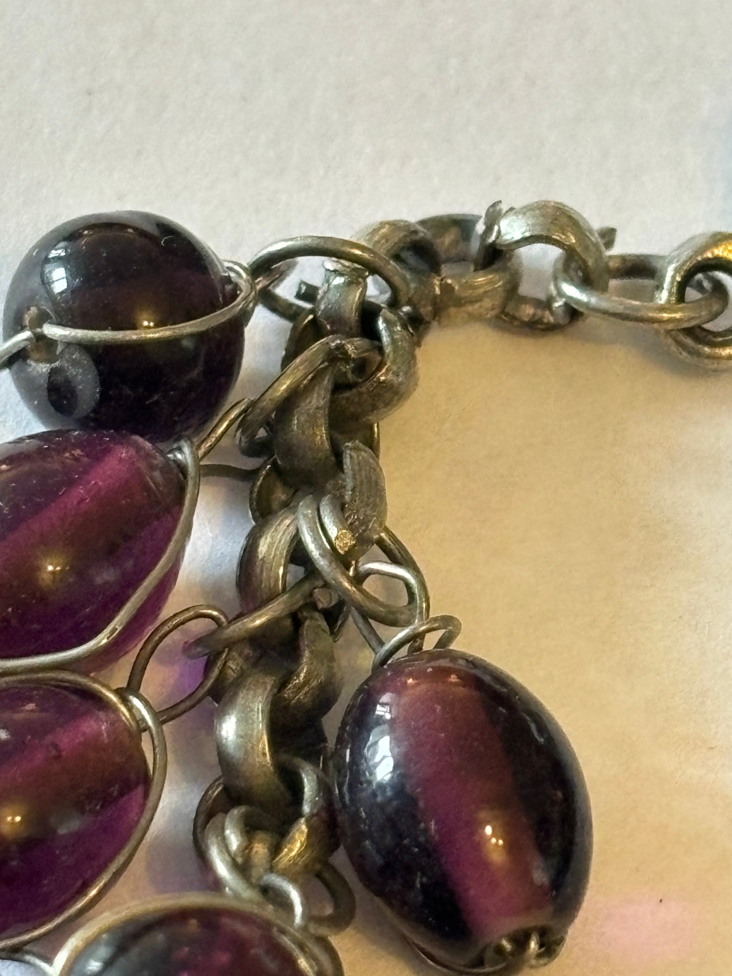 Silver metal T-Bar bracelet with dangle purple oval beads