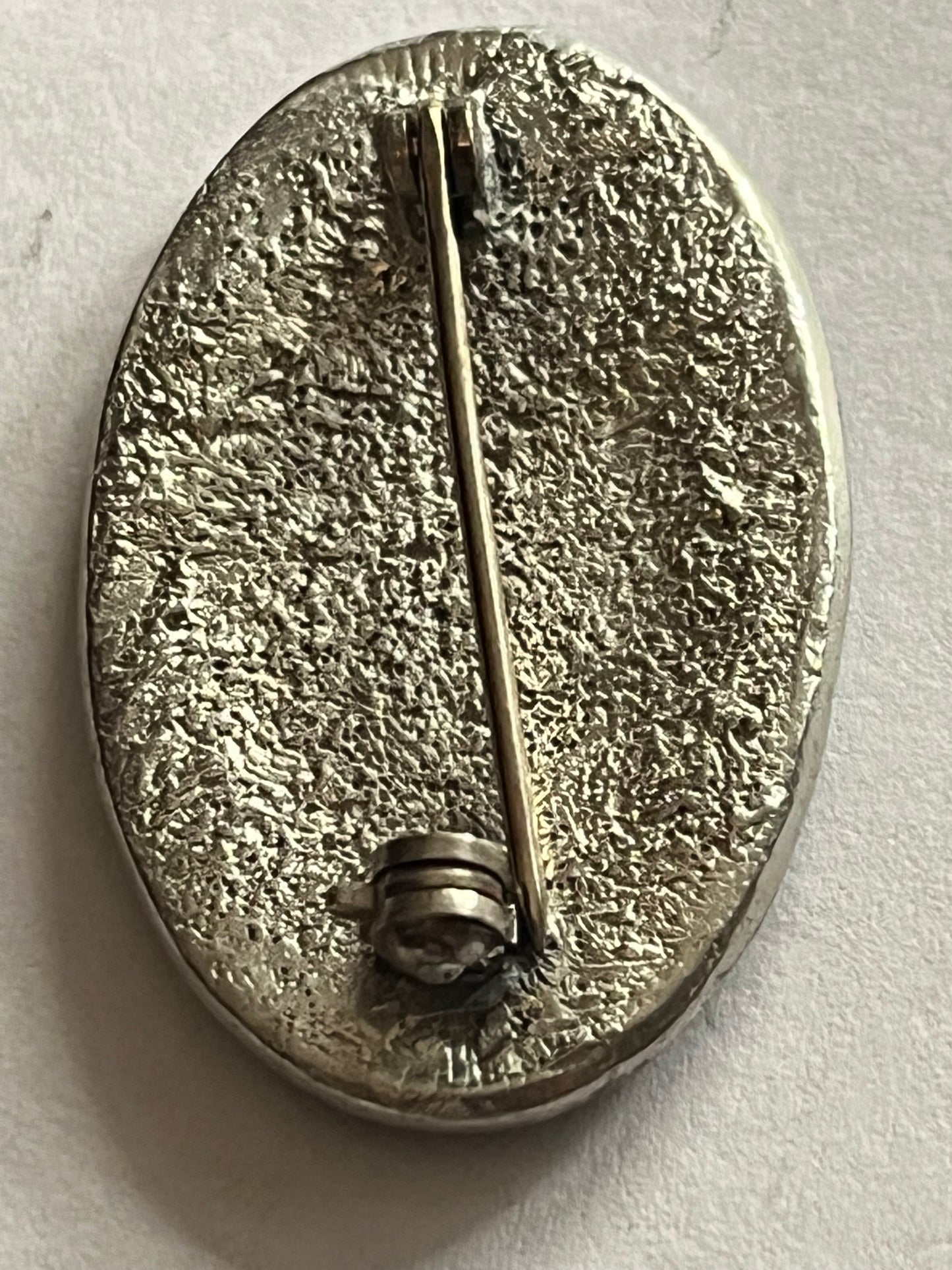 Oval black and silver shield style brooch