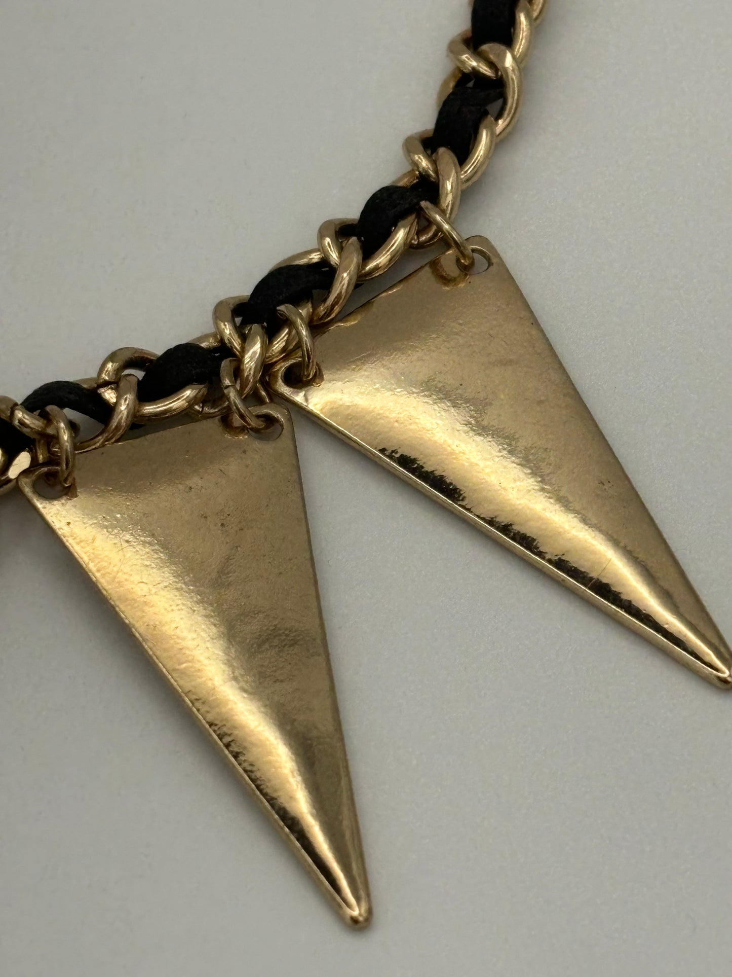 Gold and black twist necklace with triangle pendants fringe