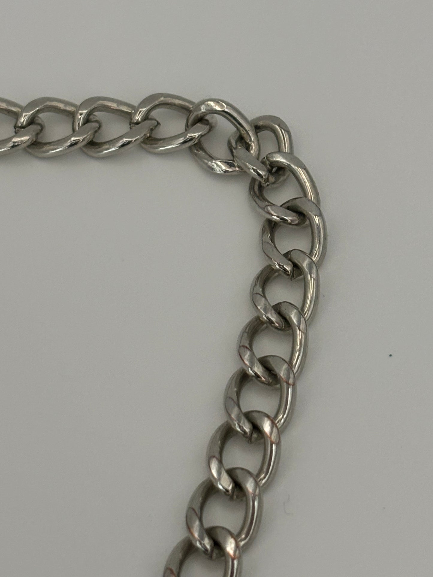 Chunky silver chain necklace with silver weave curved bar pendant