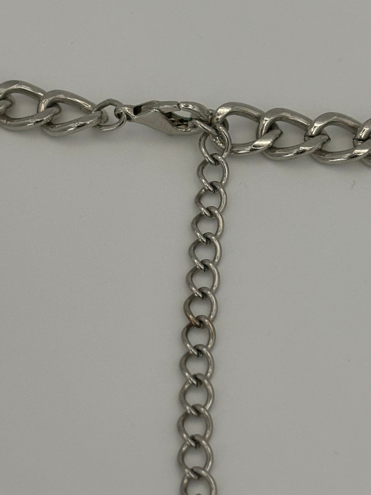 Chunky silver chain necklace with silver weave curved bar pendant