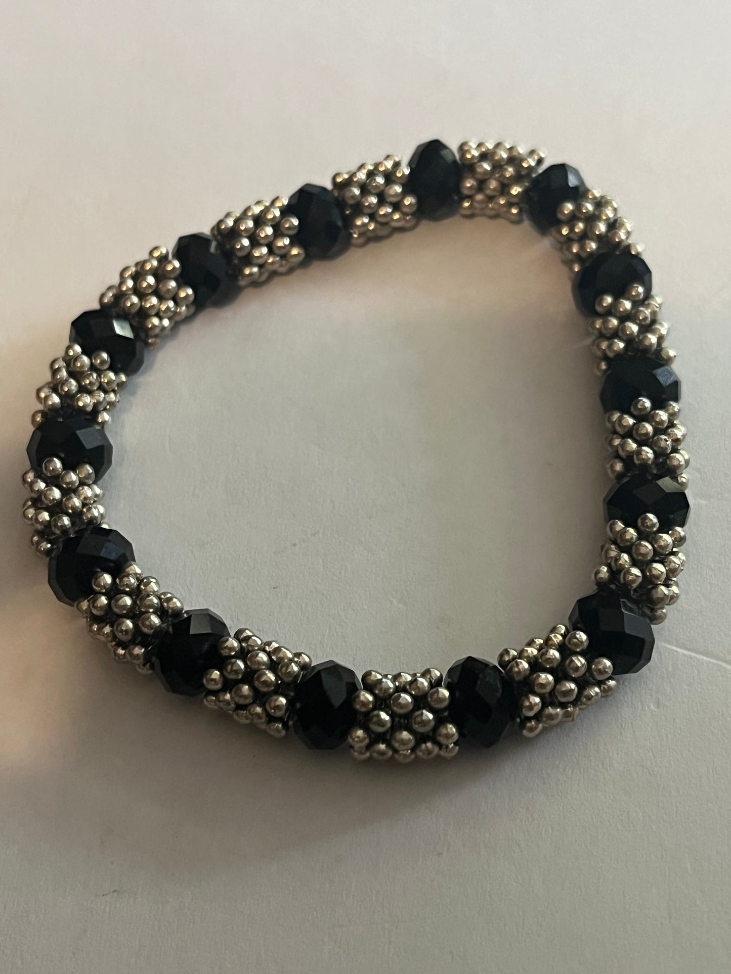 Silver bobble and black bead stretch bracelet