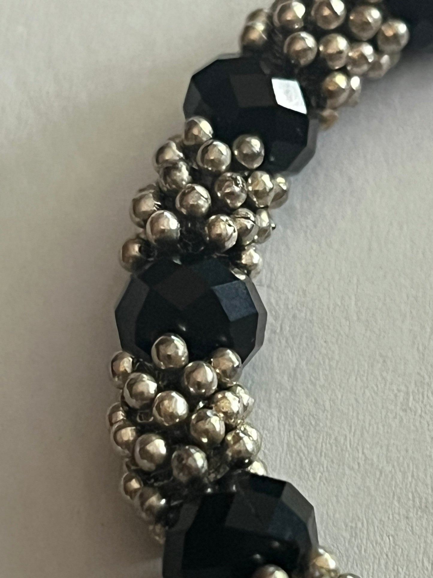 Silver bobble and black bead stretch bracelet