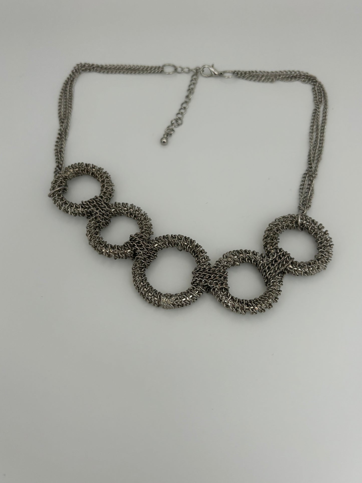 Triple silver chain necklace with heavy silver wire rings pendant