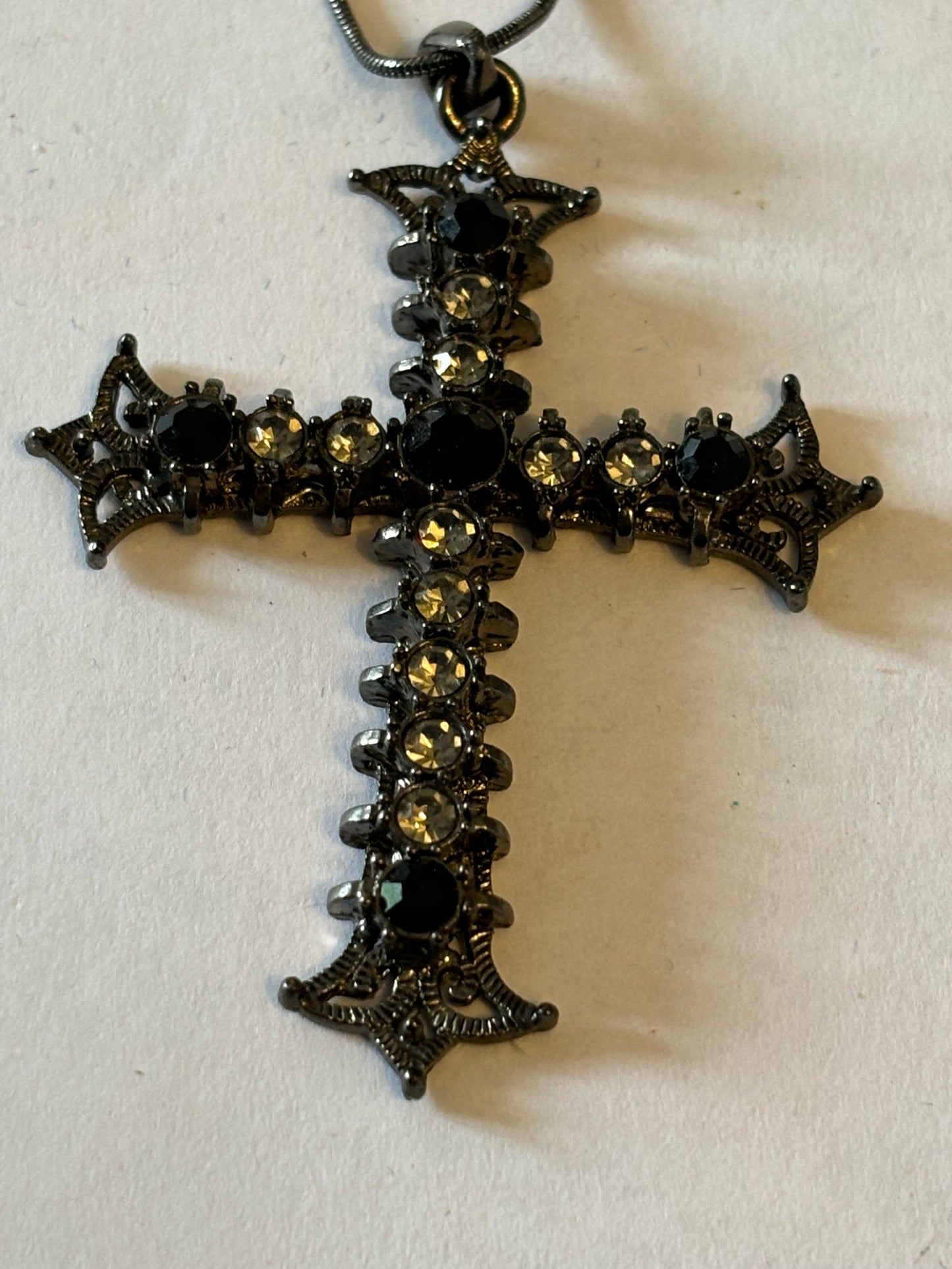 Dark metal smooth necklace with ornate jewelled cross pendant