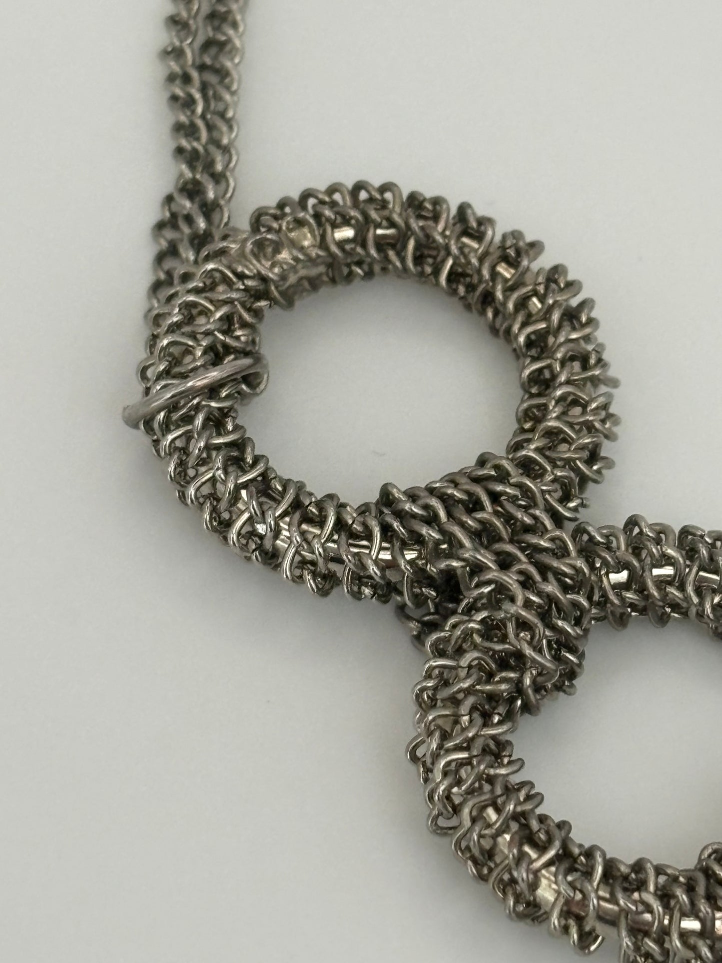 Triple silver chain necklace with heavy silver wire rings pendant