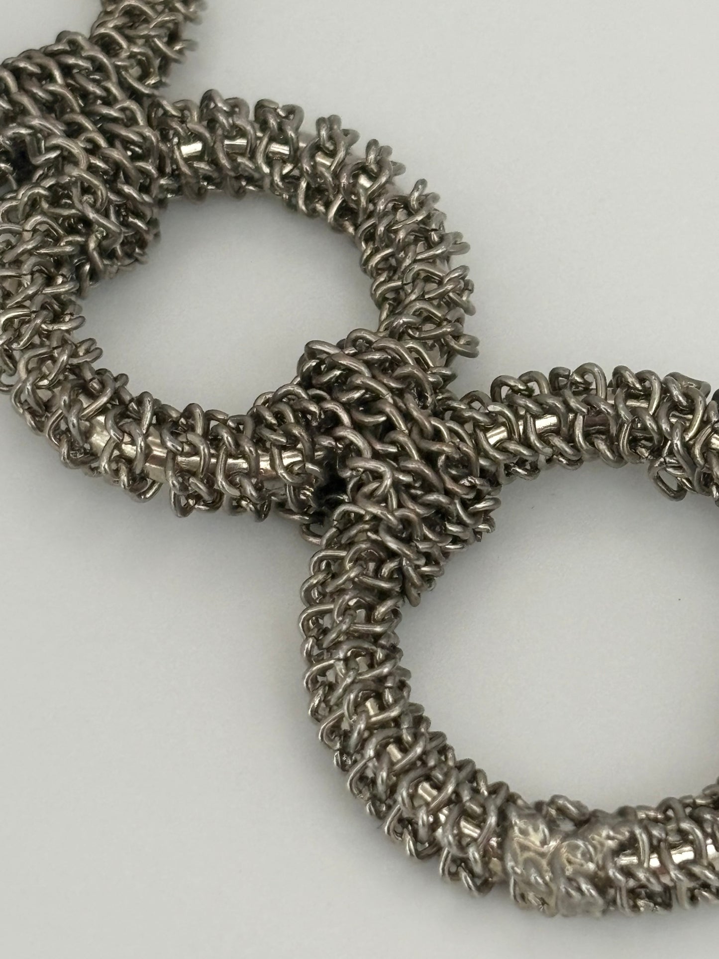 Triple silver chain necklace with heavy silver wire rings pendant