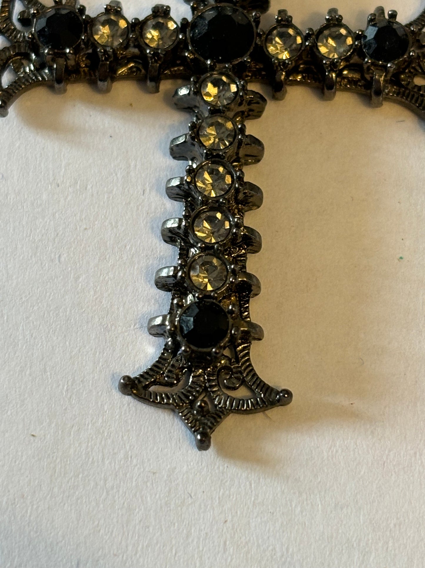 Dark metal smooth necklace with ornate jewelled cross pendant