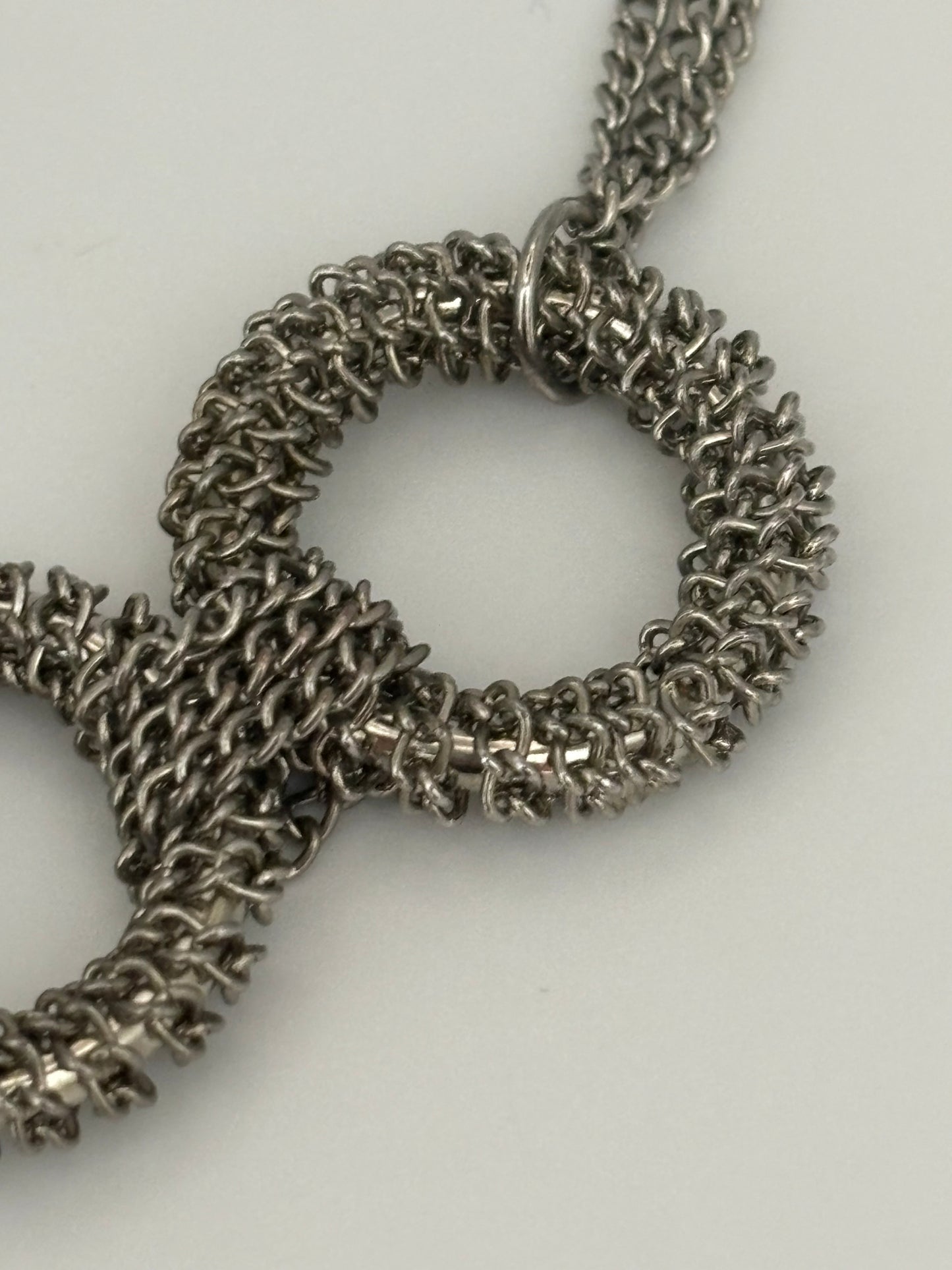 Triple silver chain necklace with heavy silver wire rings pendant