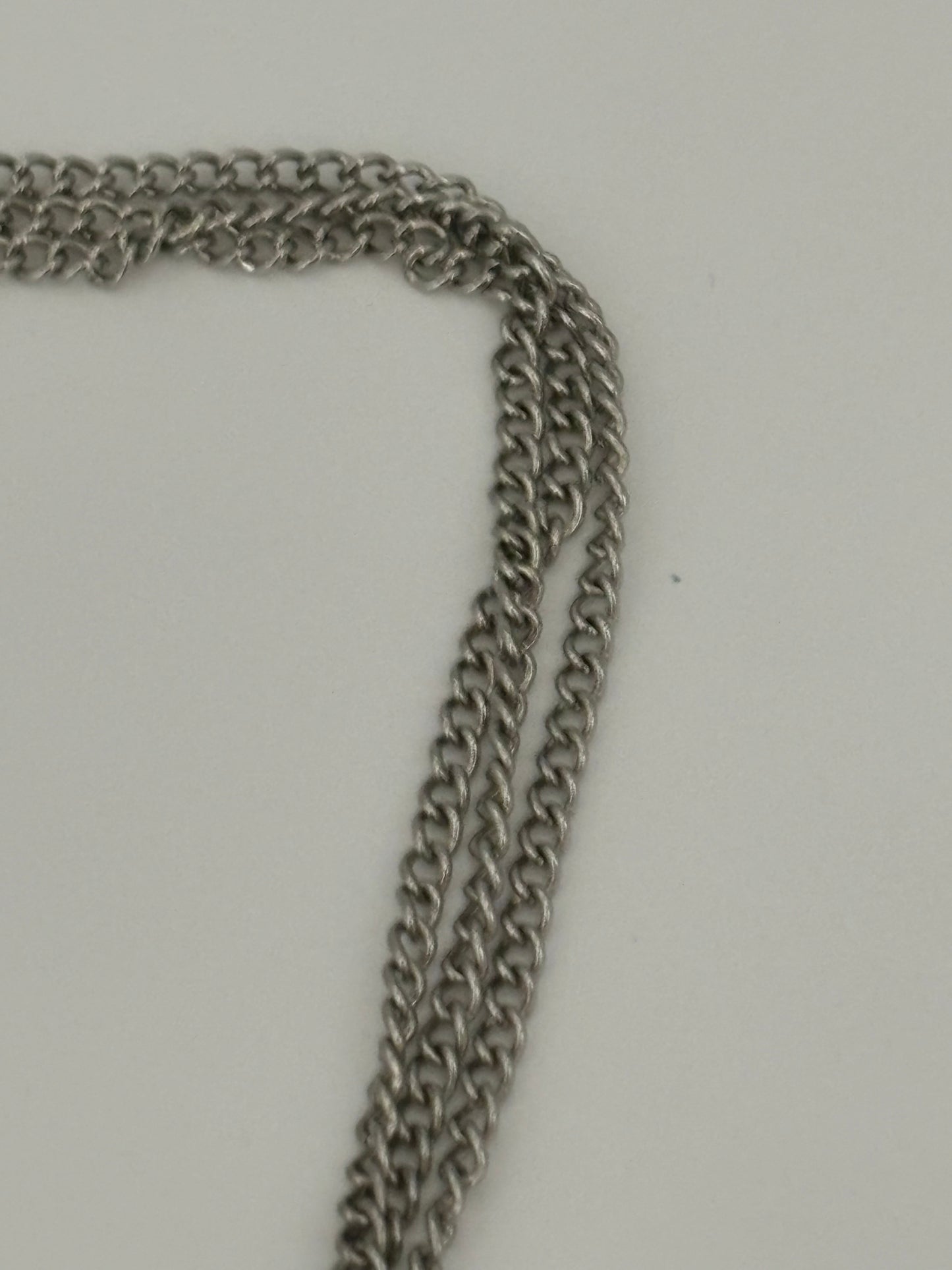 Triple silver chain necklace with heavy silver wire rings pendant