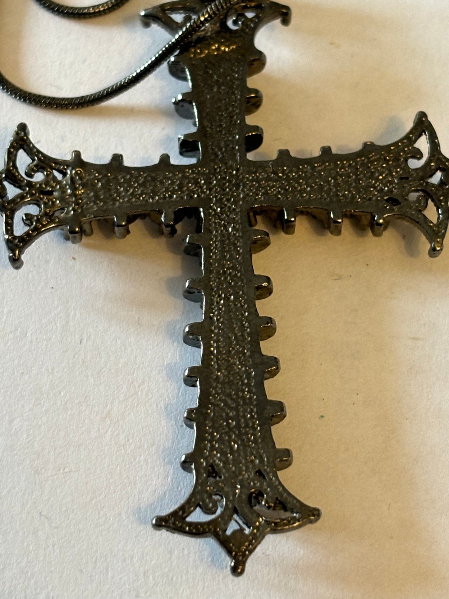 Dark metal smooth necklace with ornate jewelled cross pendant