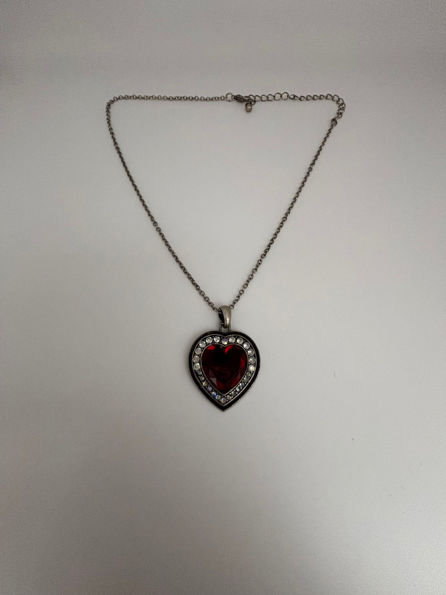 Silver necklace with red stone heart pendant