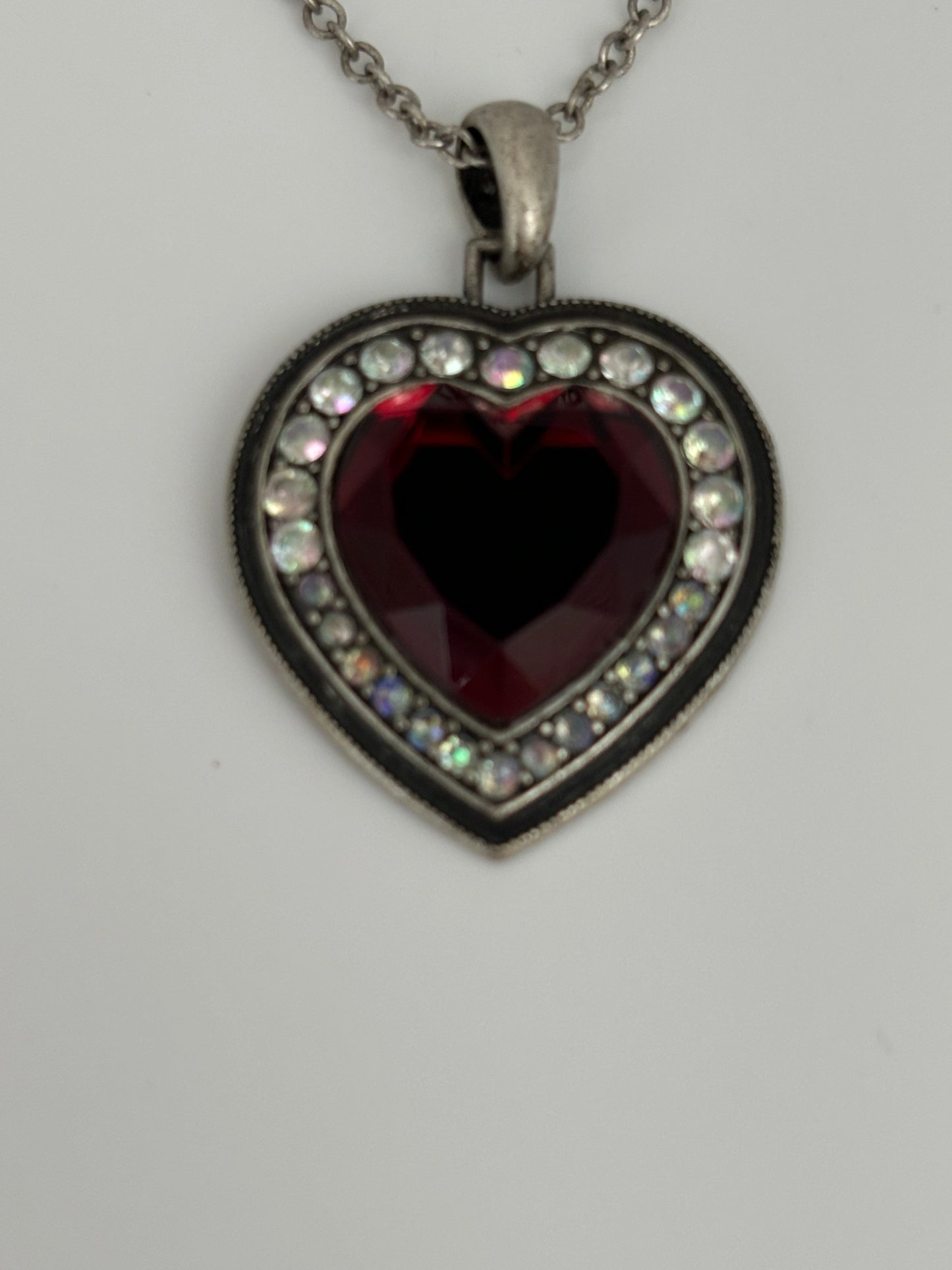 Silver necklace with red stone heart pendant