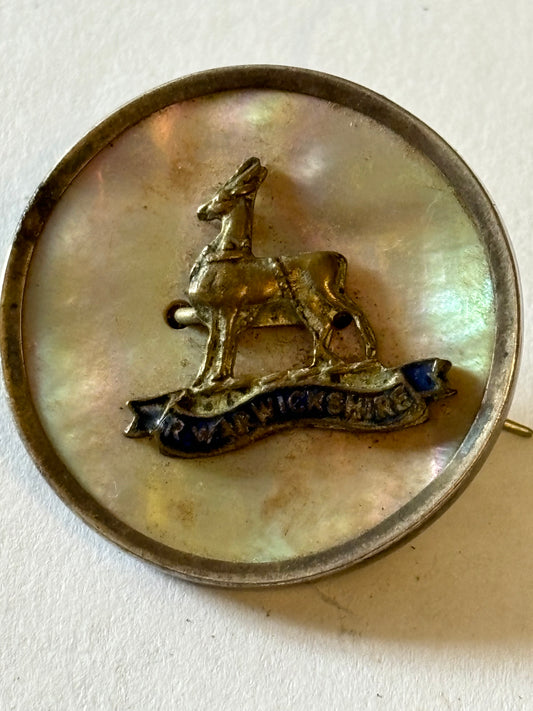 Warwickshire Regiment Brooch with pearlescent background. Sterling Silver Rim.