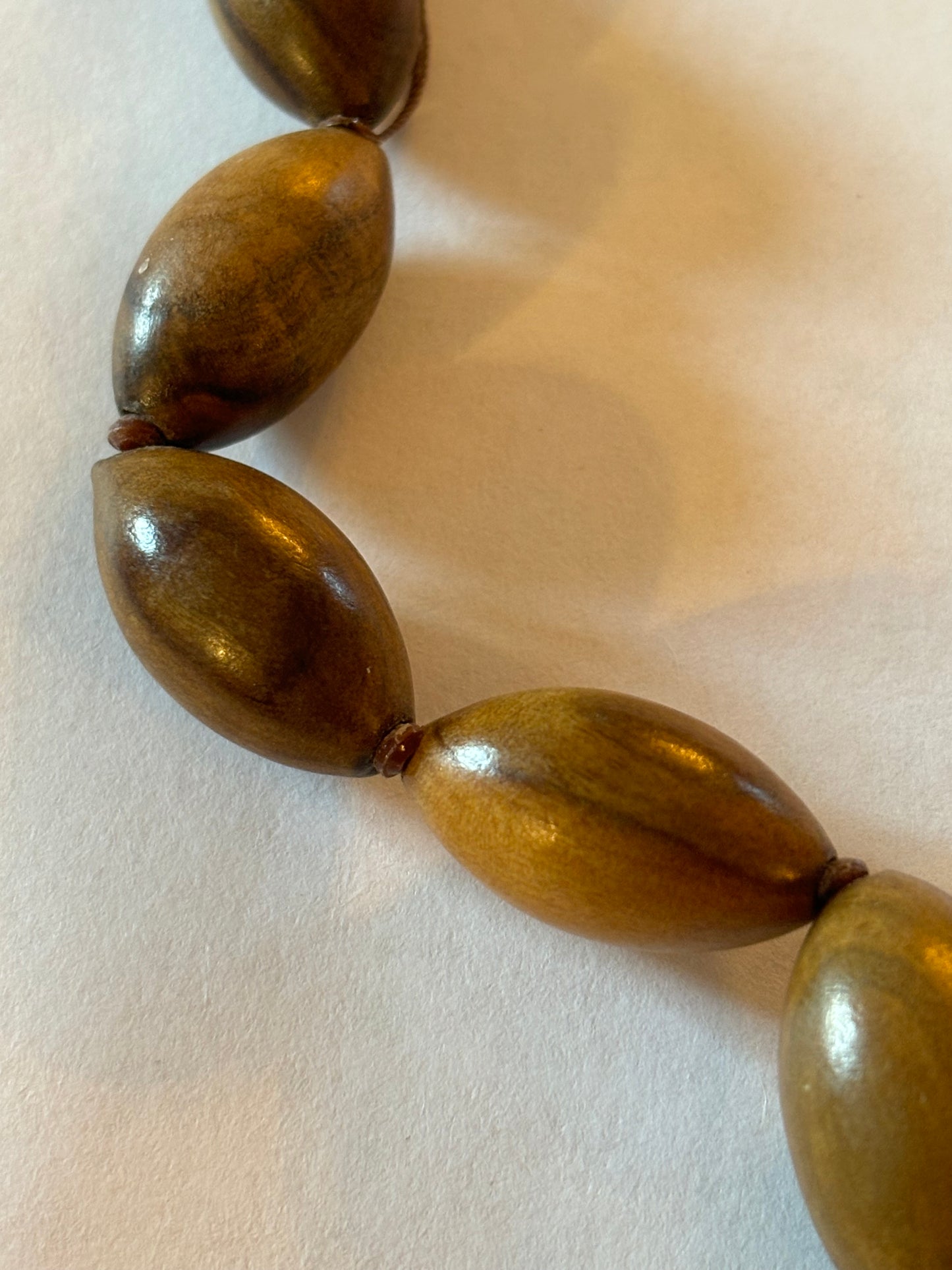 Light wooden seed shaped bead necklace