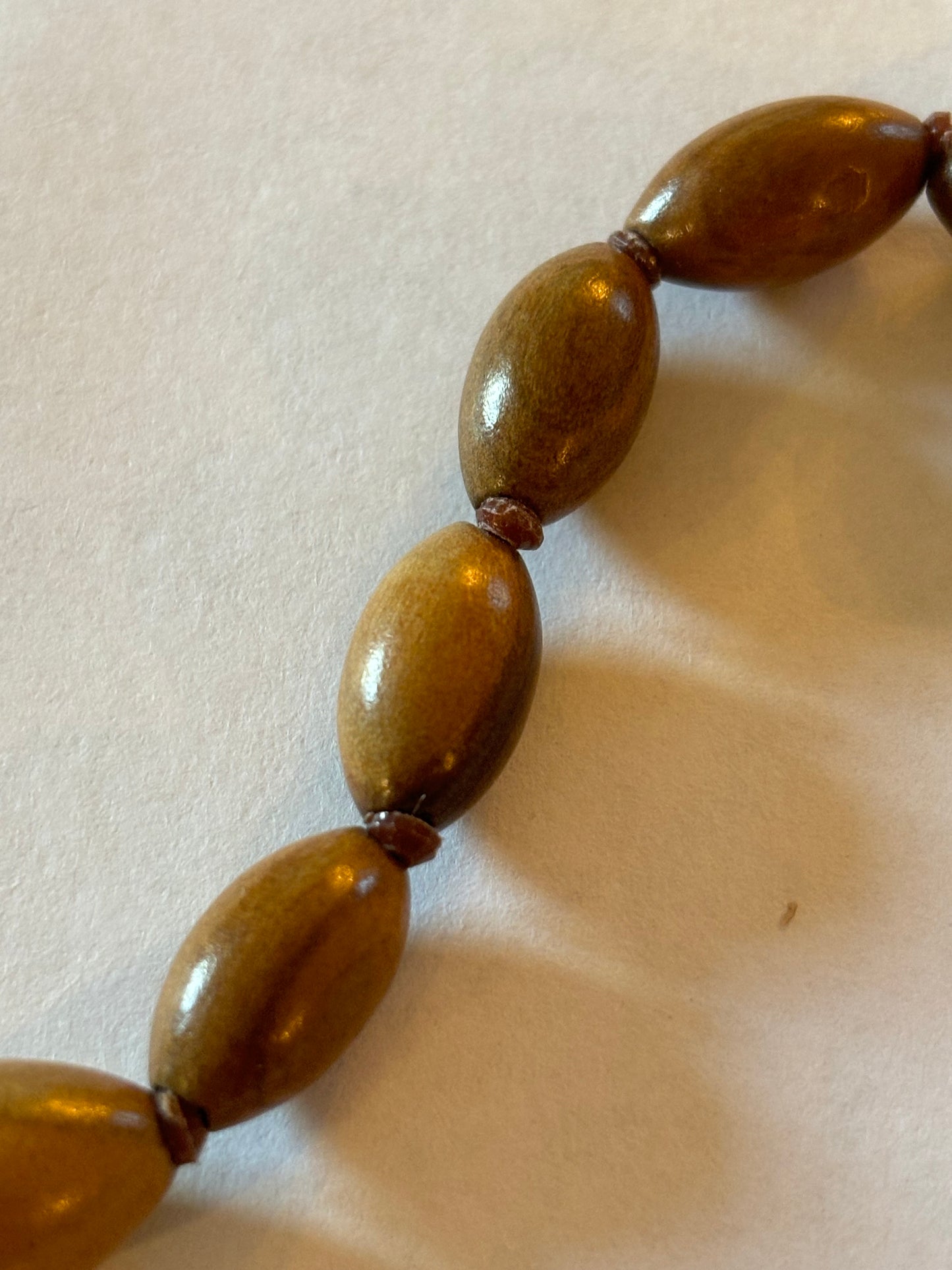 Light wooden seed shaped bead necklace