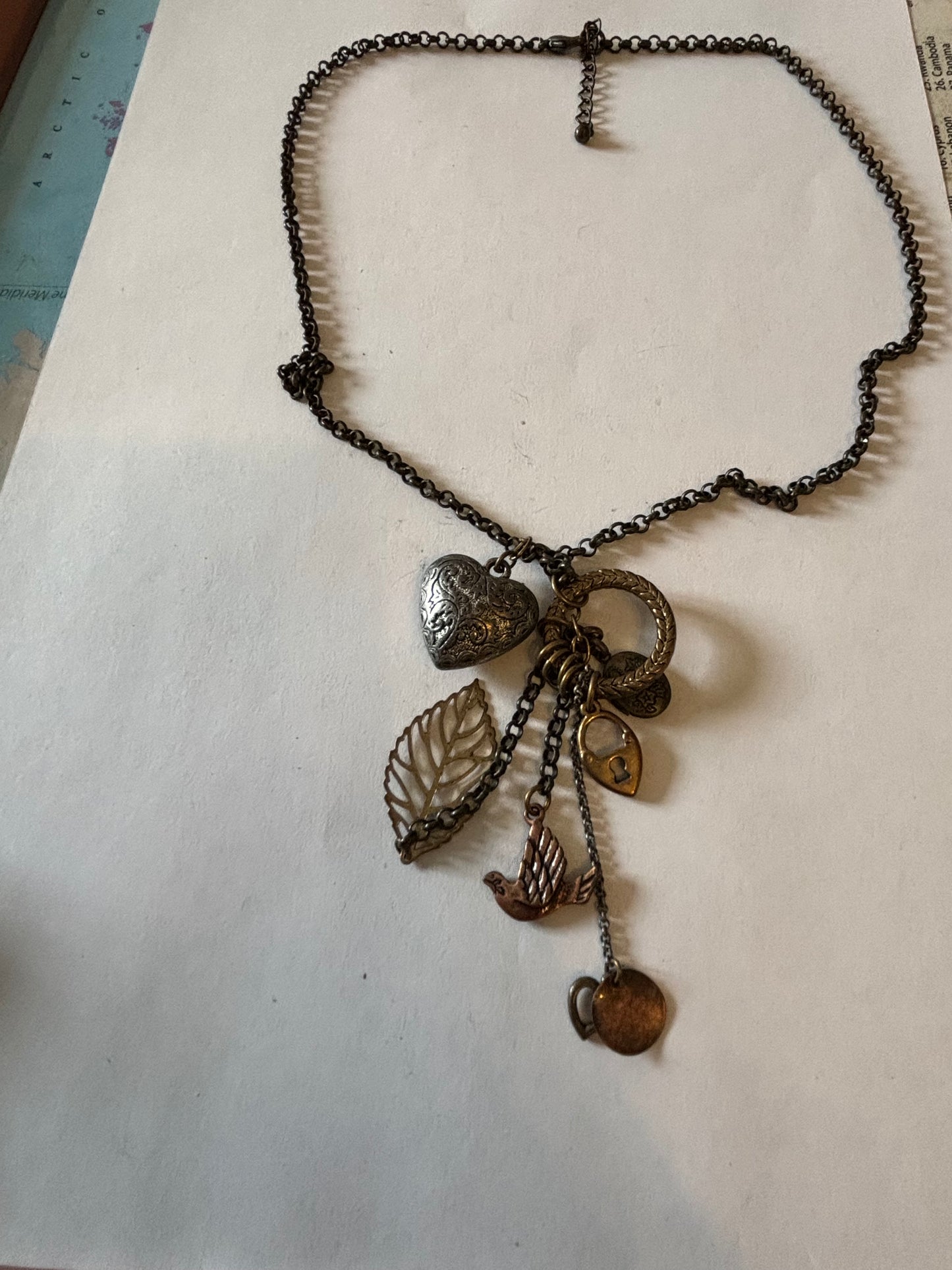 Vintage style bronzey coloured necklace with heart, leaf and padlock pendant