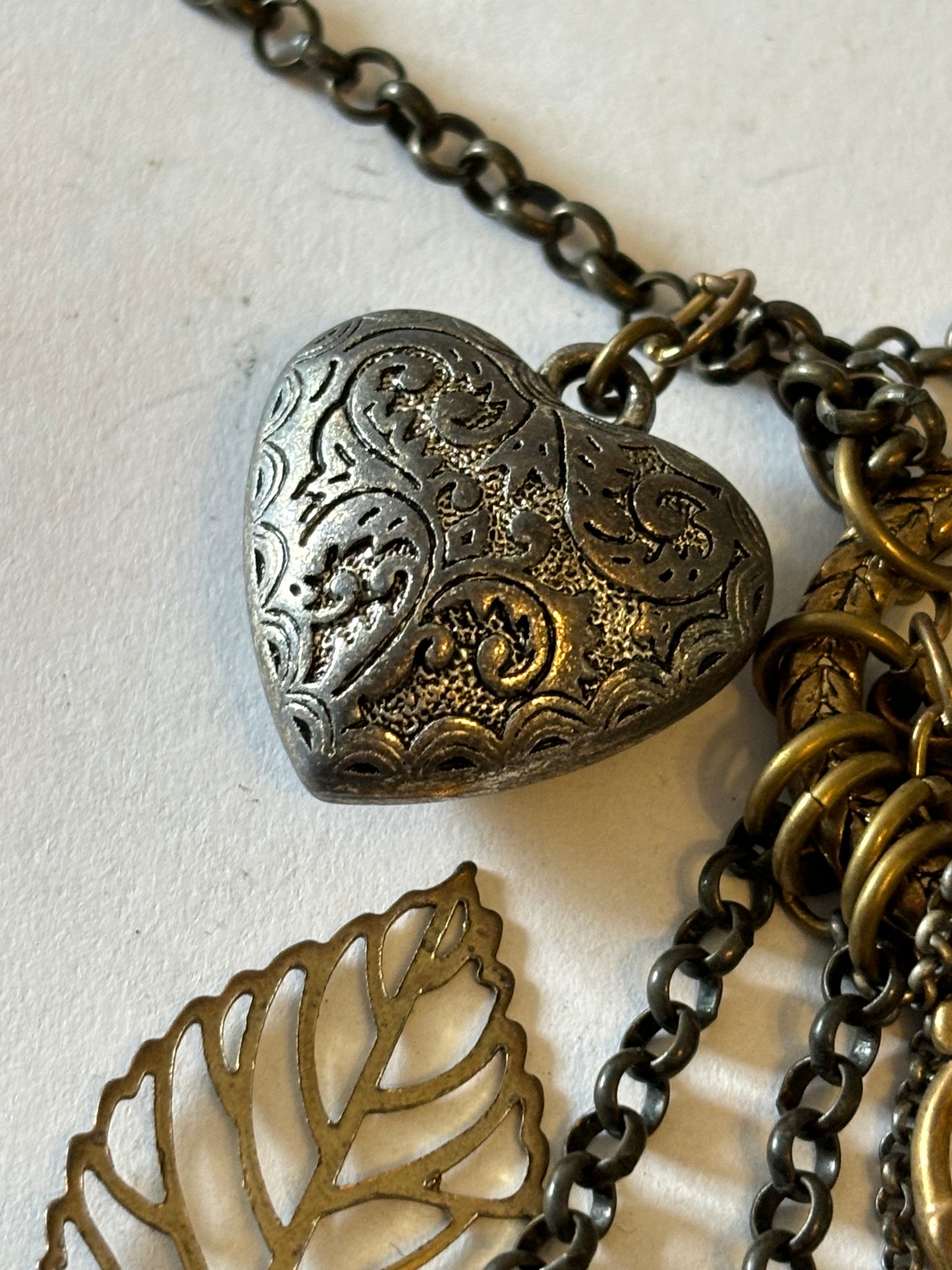 Vintage style bronzey coloured necklace with heart, leaf and padlock pendant