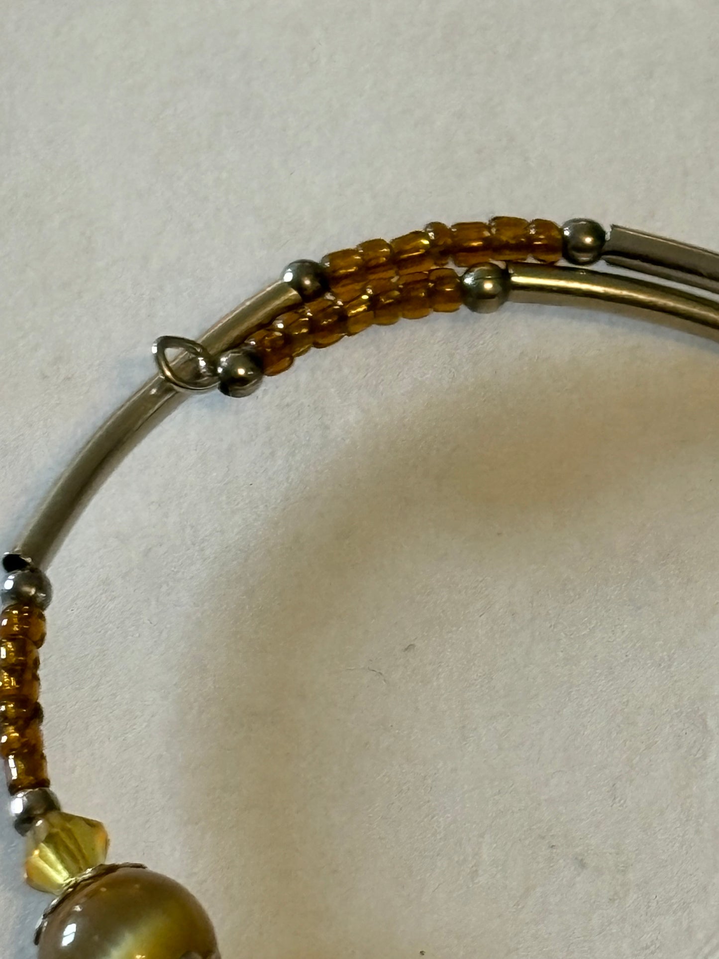 Adjustable wrap bangle with 3 glassy beads