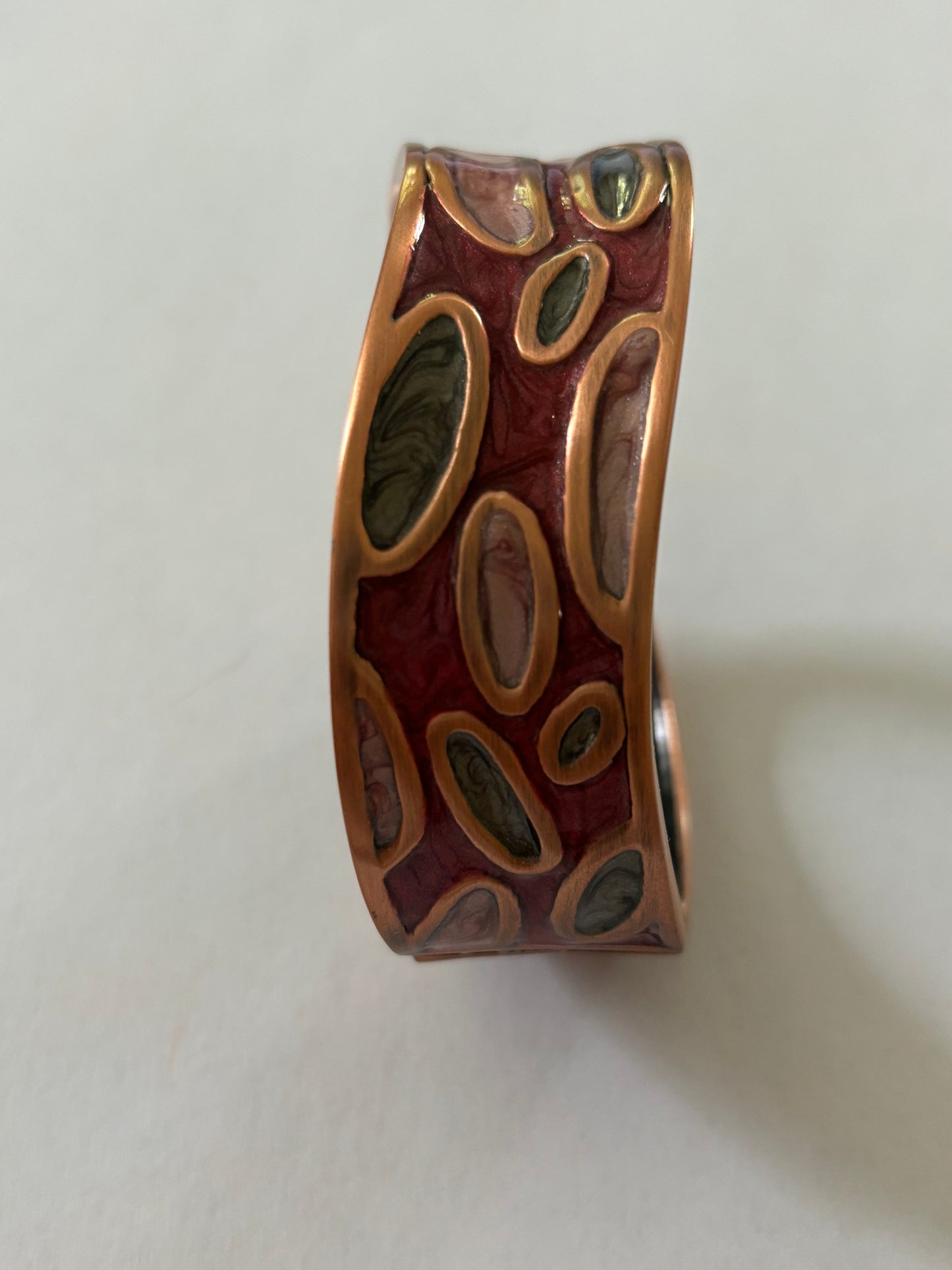 Wavy copper colour and enamel spring bangle