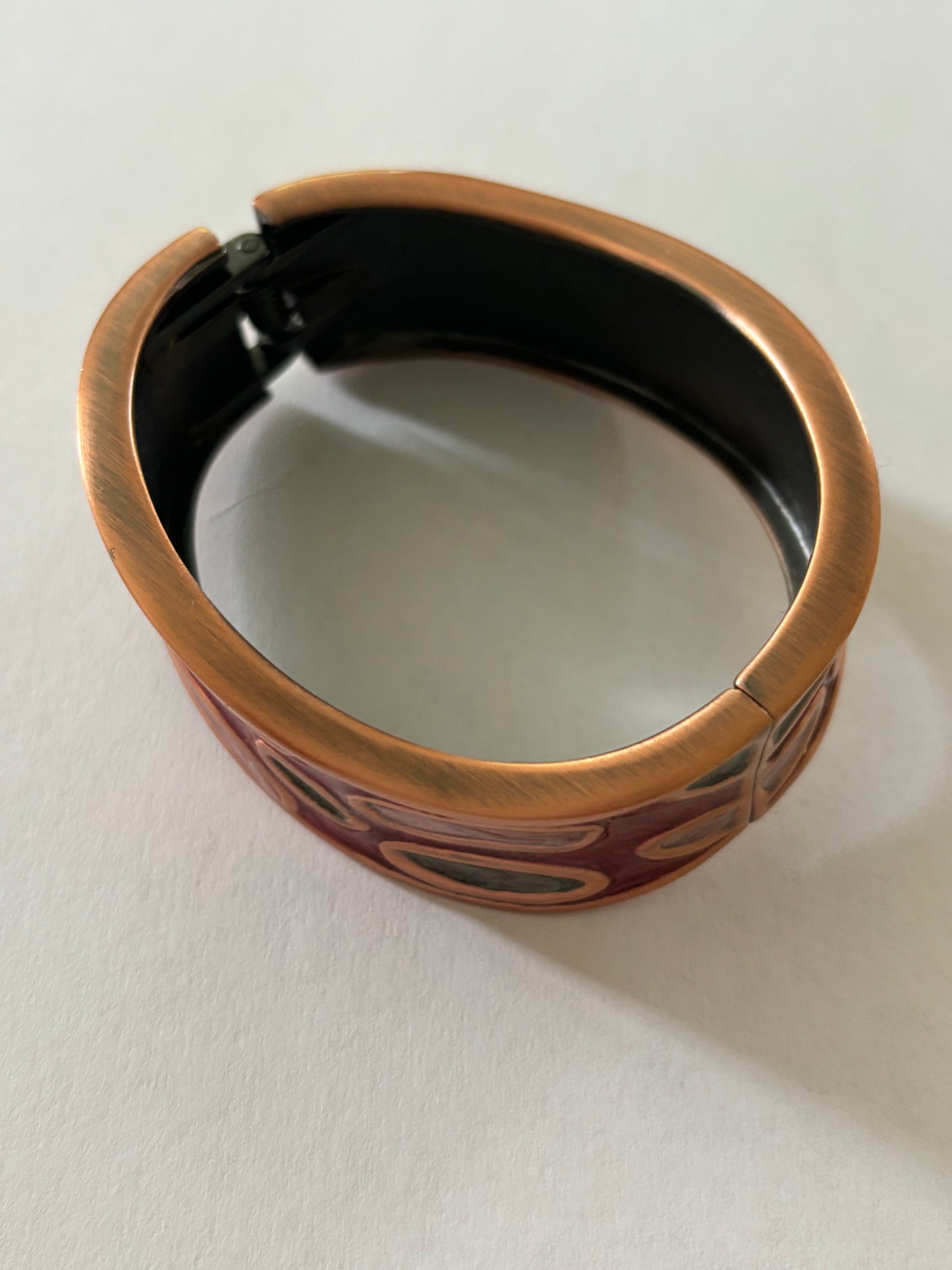 Wavy copper colour and enamel spring bangle