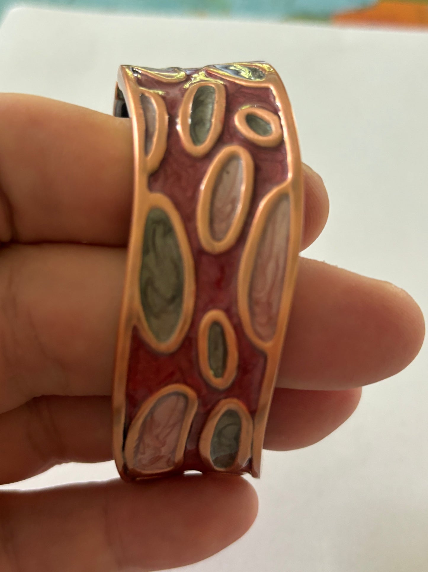 Wavy copper colour and enamel spring bangle