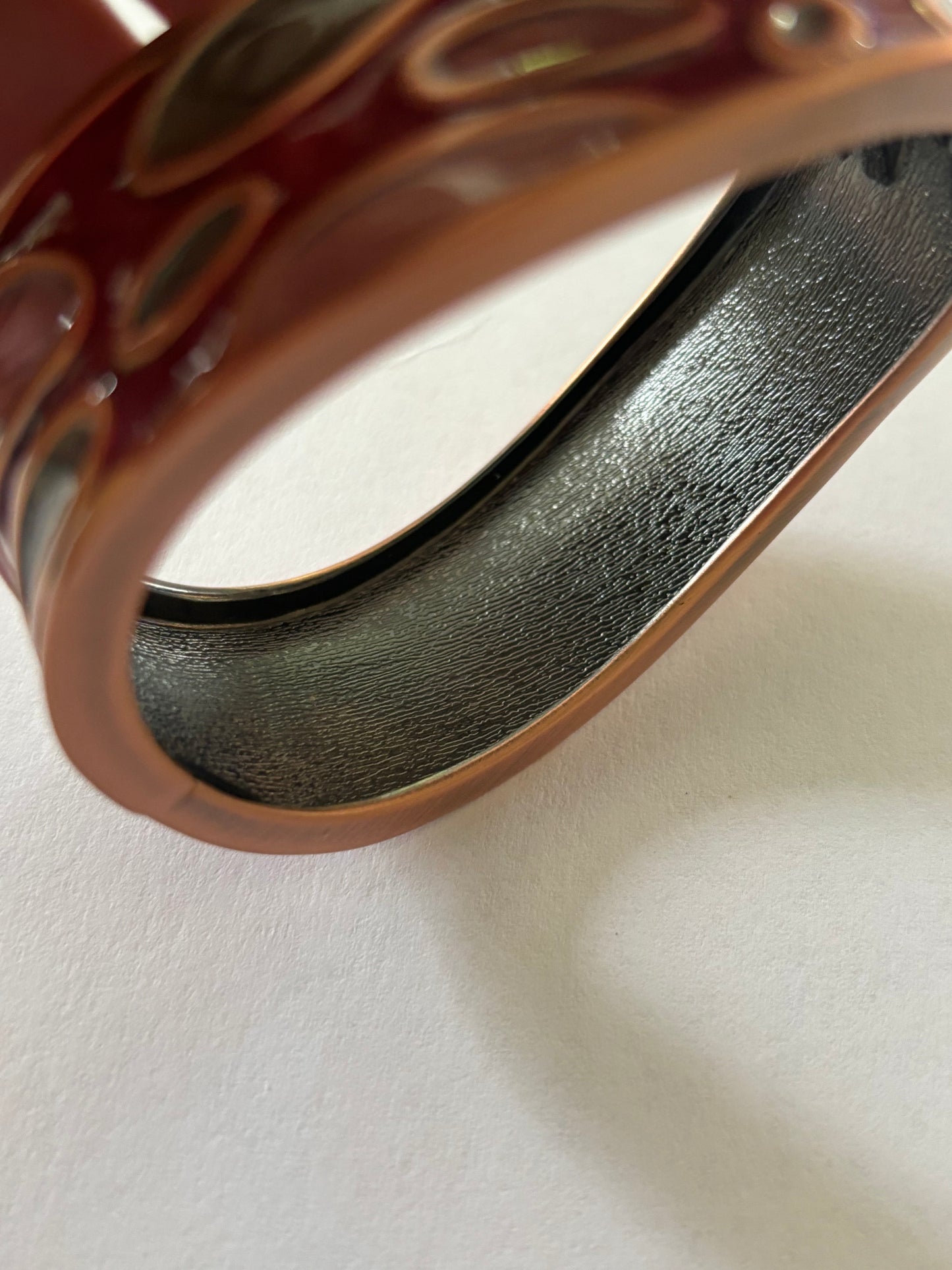 Wavy copper colour and enamel spring bangle