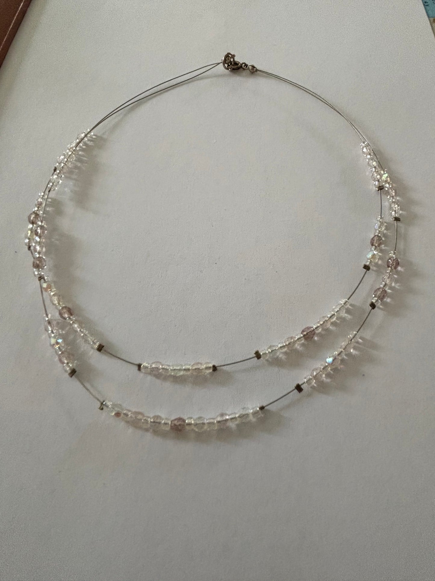 Double silver wire necklace with sliding small clear beads