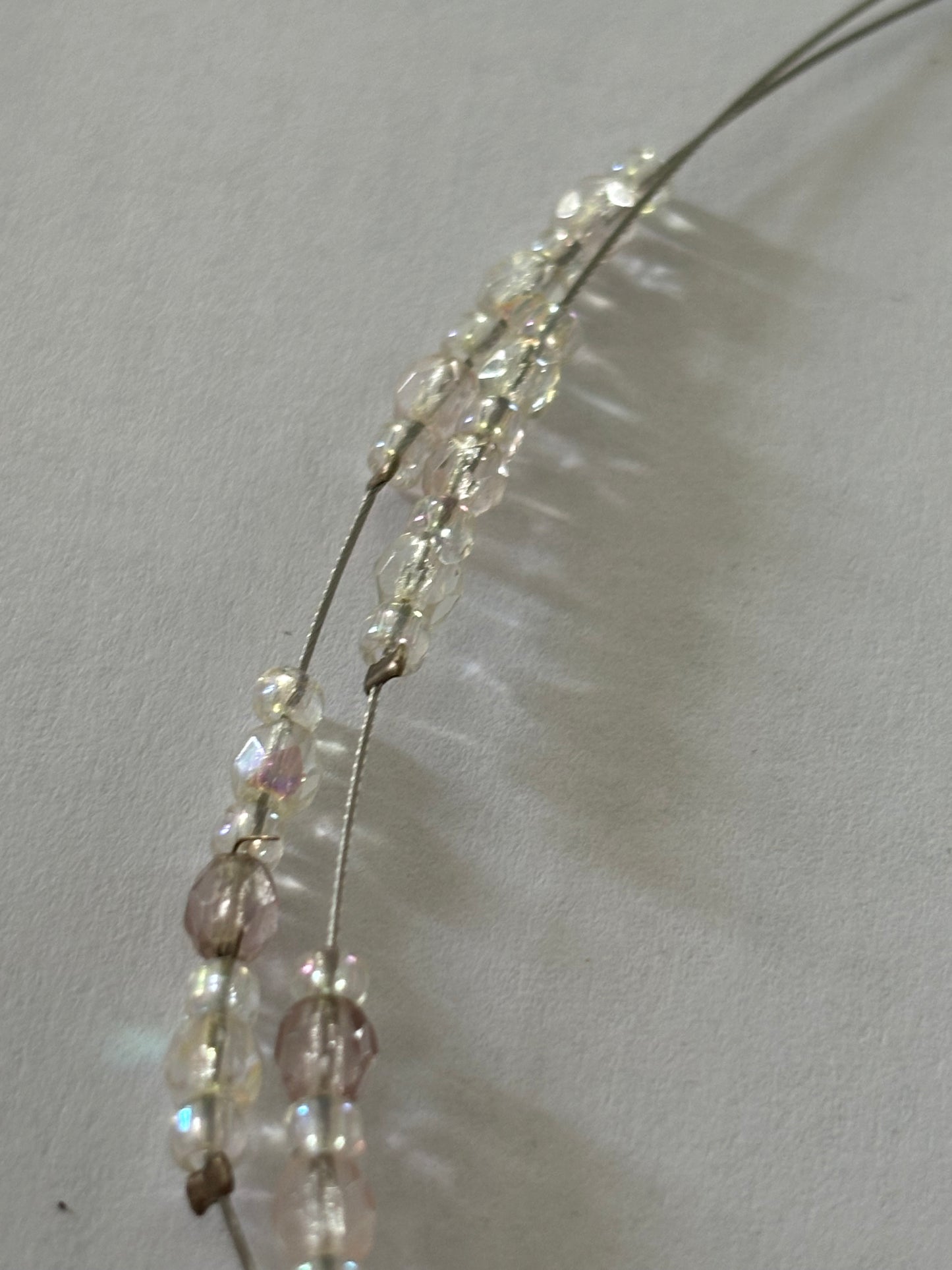 Double silver wire necklace with sliding small clear beads